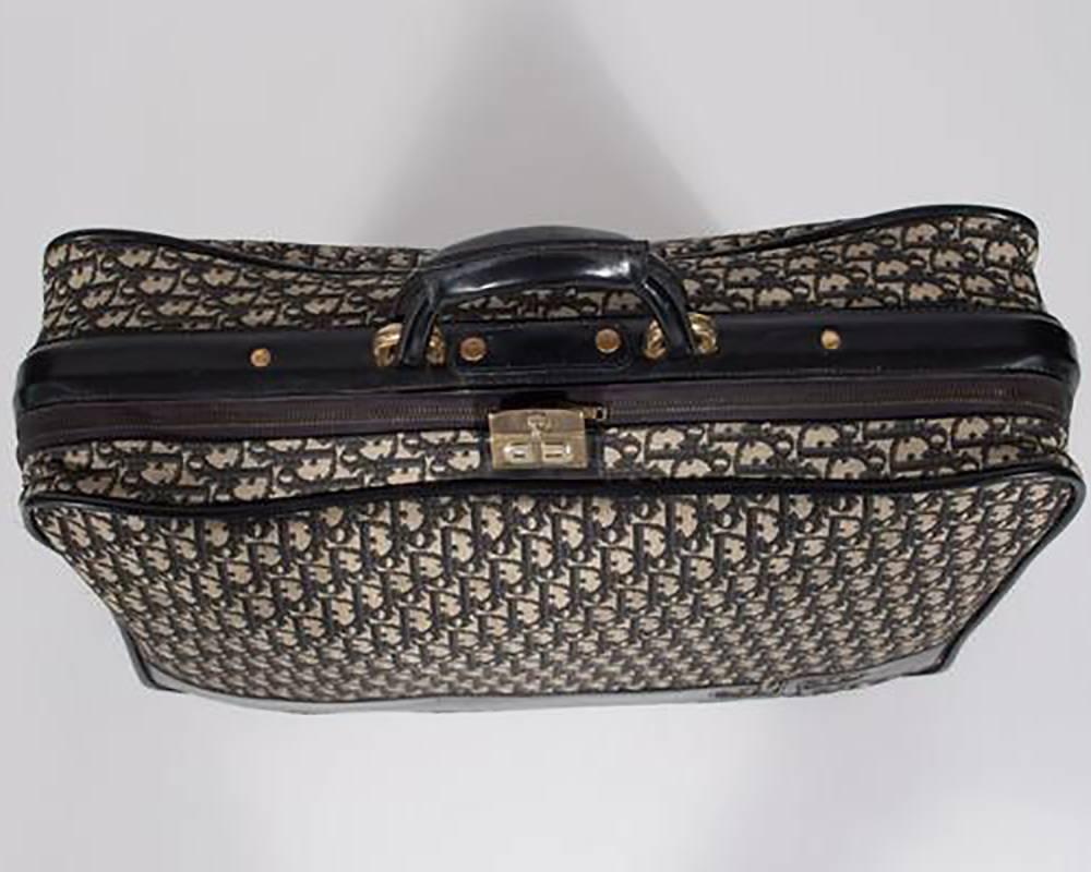 Large Christian Dior Suitcase with 1970s era navy blue and cream logo. 
 
-Measurements-
length: 23