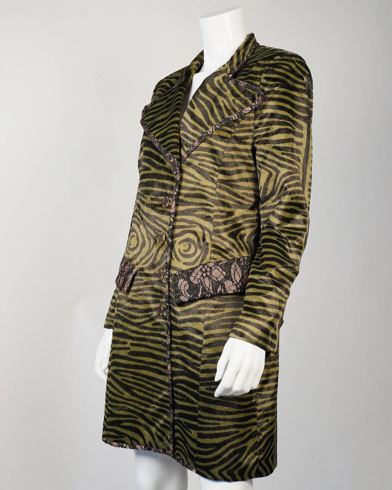 Christian Lacroix for Bazar Tiger print coat with fantastic wide lapels with black lace trim along the pockets and lapel. 

Made in France
Size: 44
Measurements: 
36 inches long top to bottom
24 inch sleeve length

Good Vintage Condition: Please