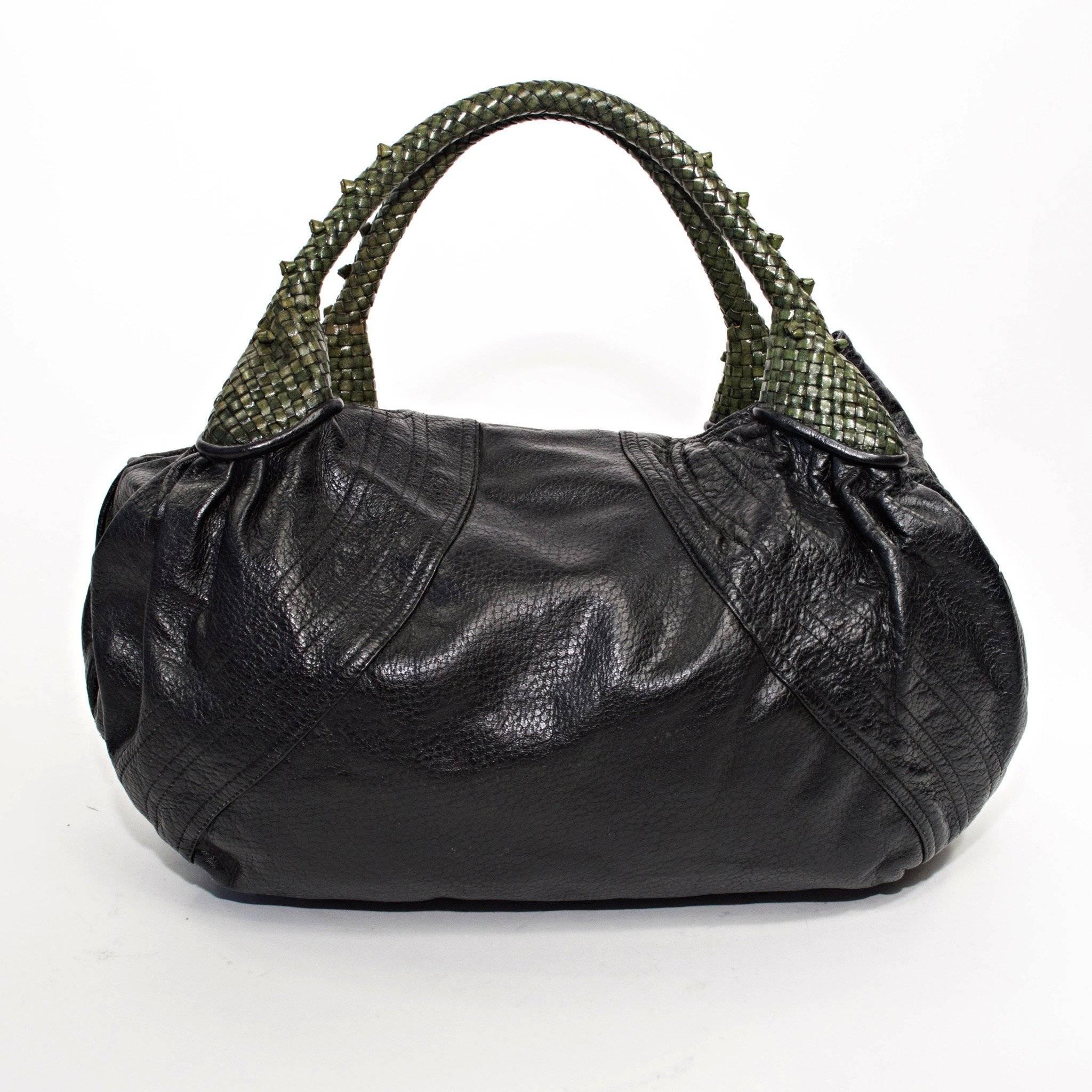 Fendi Spy Bag with Black Nappa Leather and Green Woven Handles with built in Coin Purse. 

Measurements
8