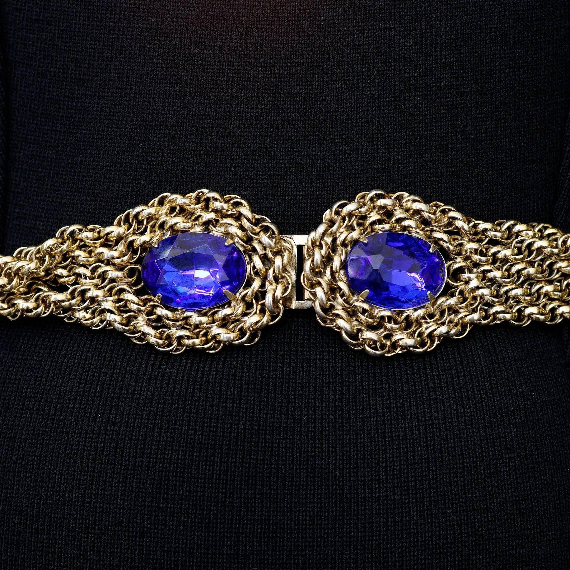 Circa 1970 goldtones twist belt with 5 twisted chains and blue glass stone polished accents at the top of each clasp

Size: 28.5 inches long , 1 inch thick

Good Vintage Condition: Please remember all clothes are previously owned and gently worn