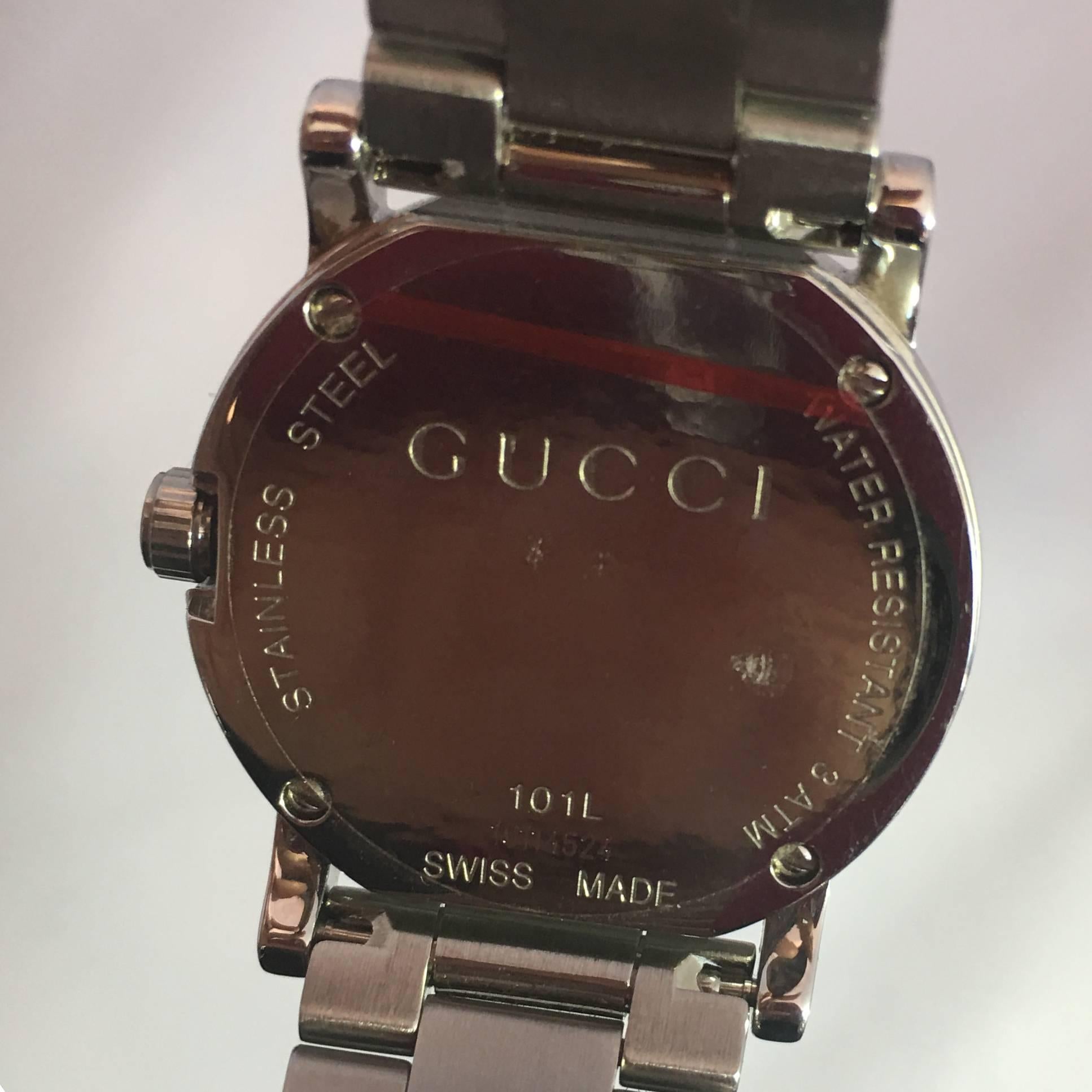 gucci watch with mother of pearl face and diamonds