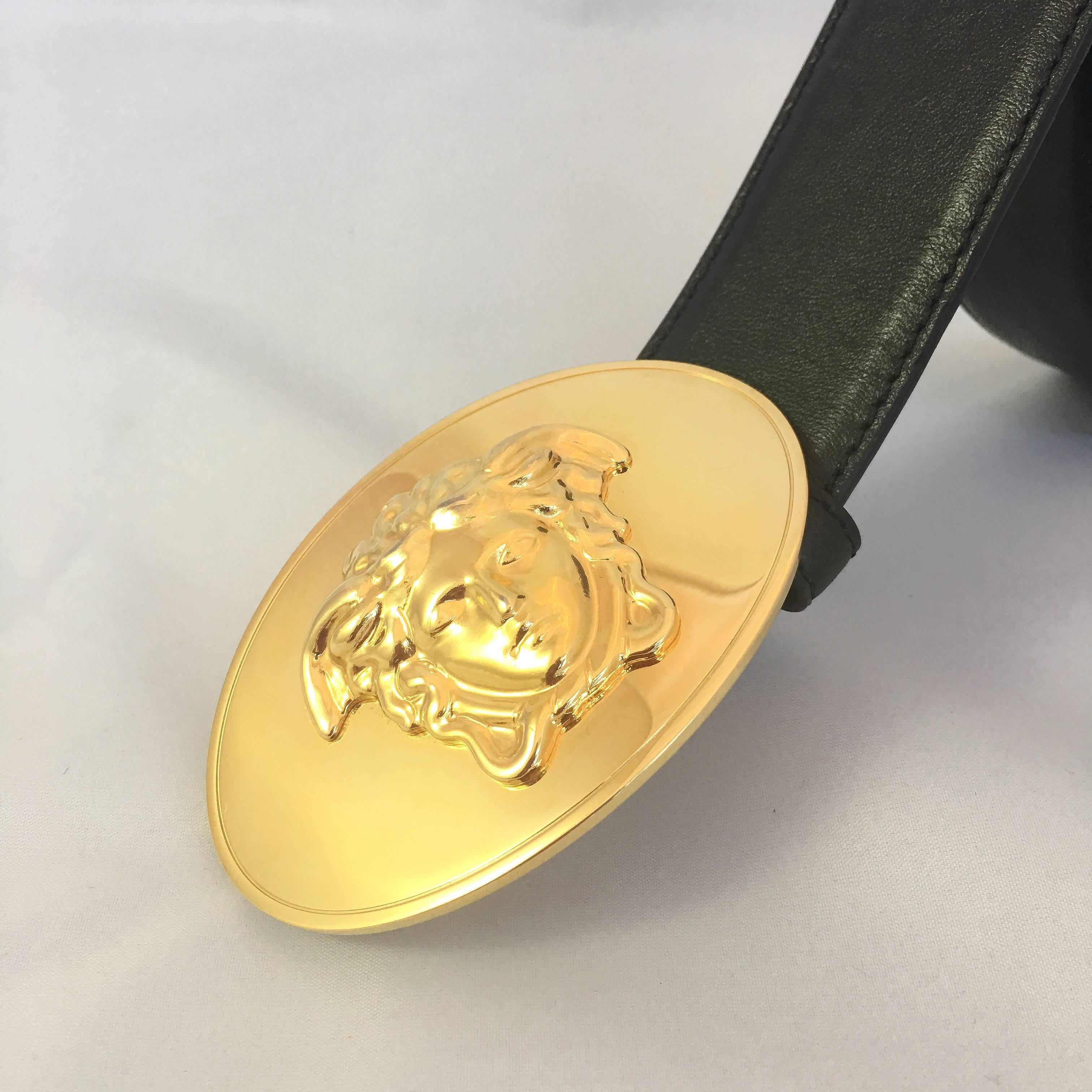 Versace black calf leather Medusa medallion belt with gold-tone hardware and an adjustable fit. 
There is a minor scratch on the buckle. (Please see last photo for reference)

Measurements:
Buckle: 3.5