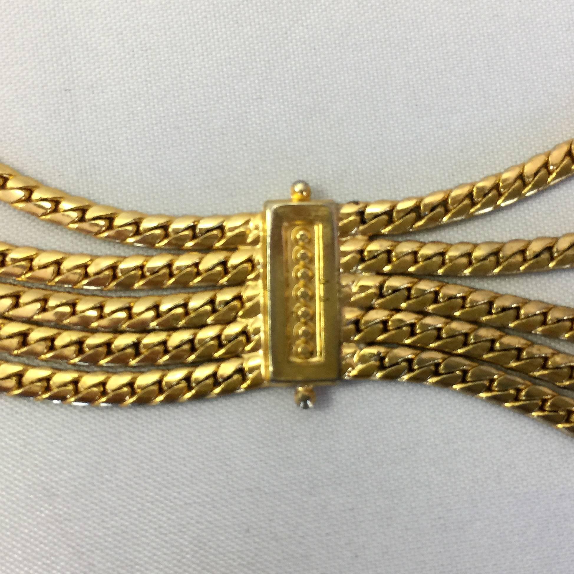 Christian Dior mehrreihiger goldfarbener Seilkettengürtel mit geometrischen Akzenten. 

Unterschrieben: Christian Dior

Messungen:
1