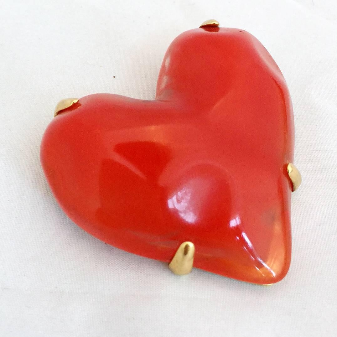 Givenchy haute couture red lucite and gold tone heart brooch and clip-on earring set. 

Signed 