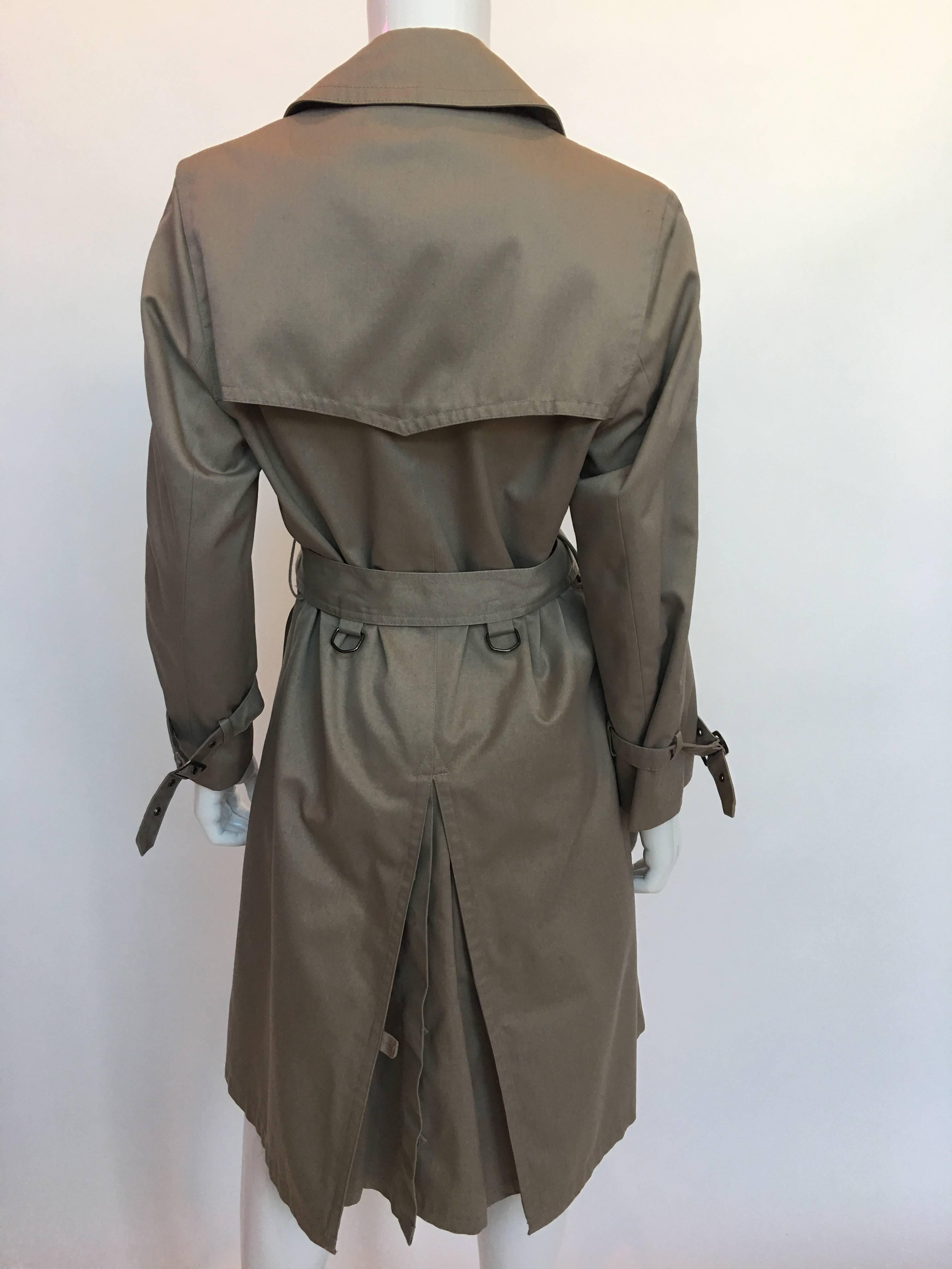 1970s Pierre Cardin Tan Trenchcoat

Made in France
Size label 38

All measurements taken flat:
Shoulders: 15