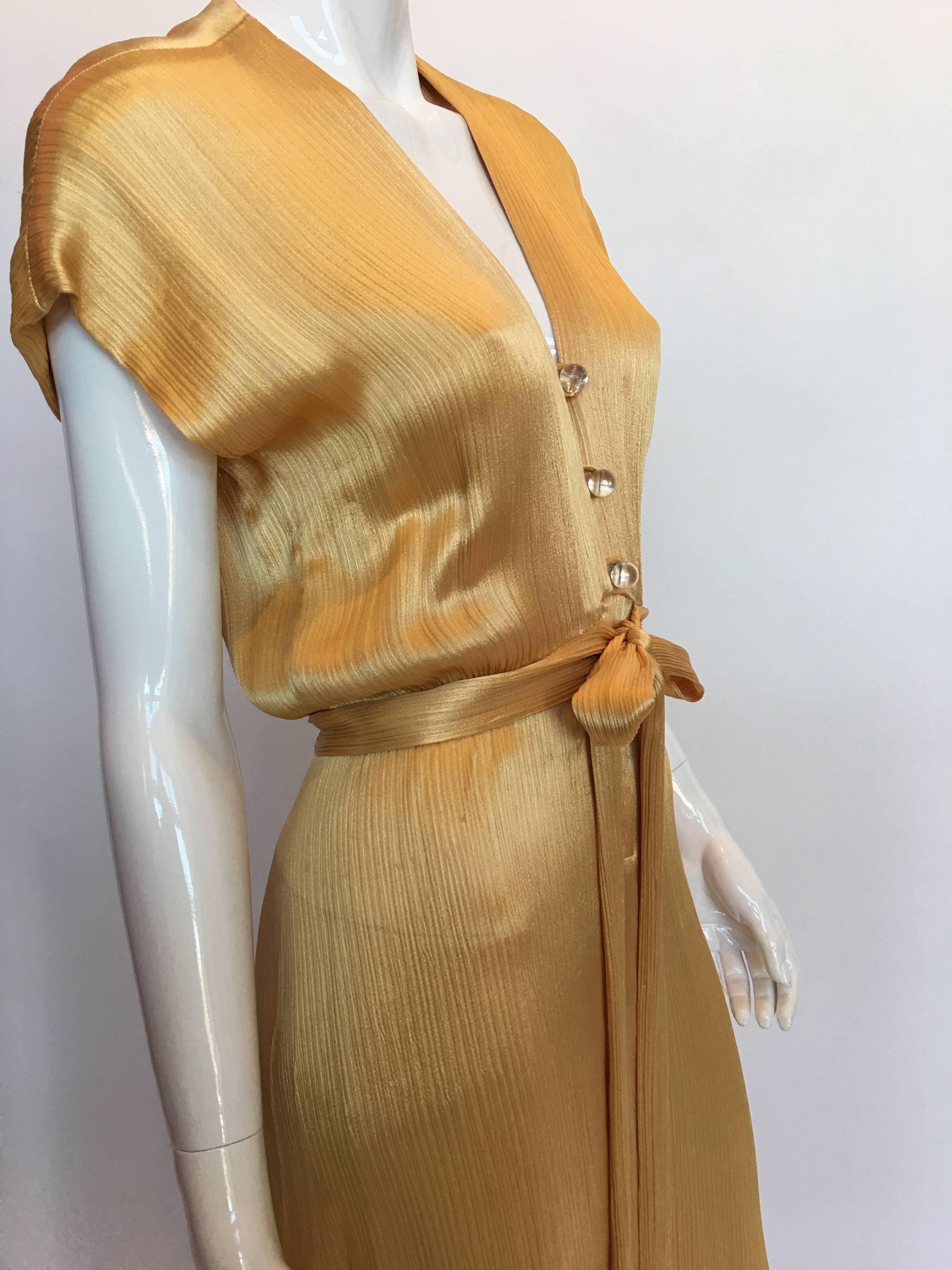Hollys Harp 1970's Gold Silk Evening Gown

Size label: S

Measurements taken flat:
Shoulders: 24.5