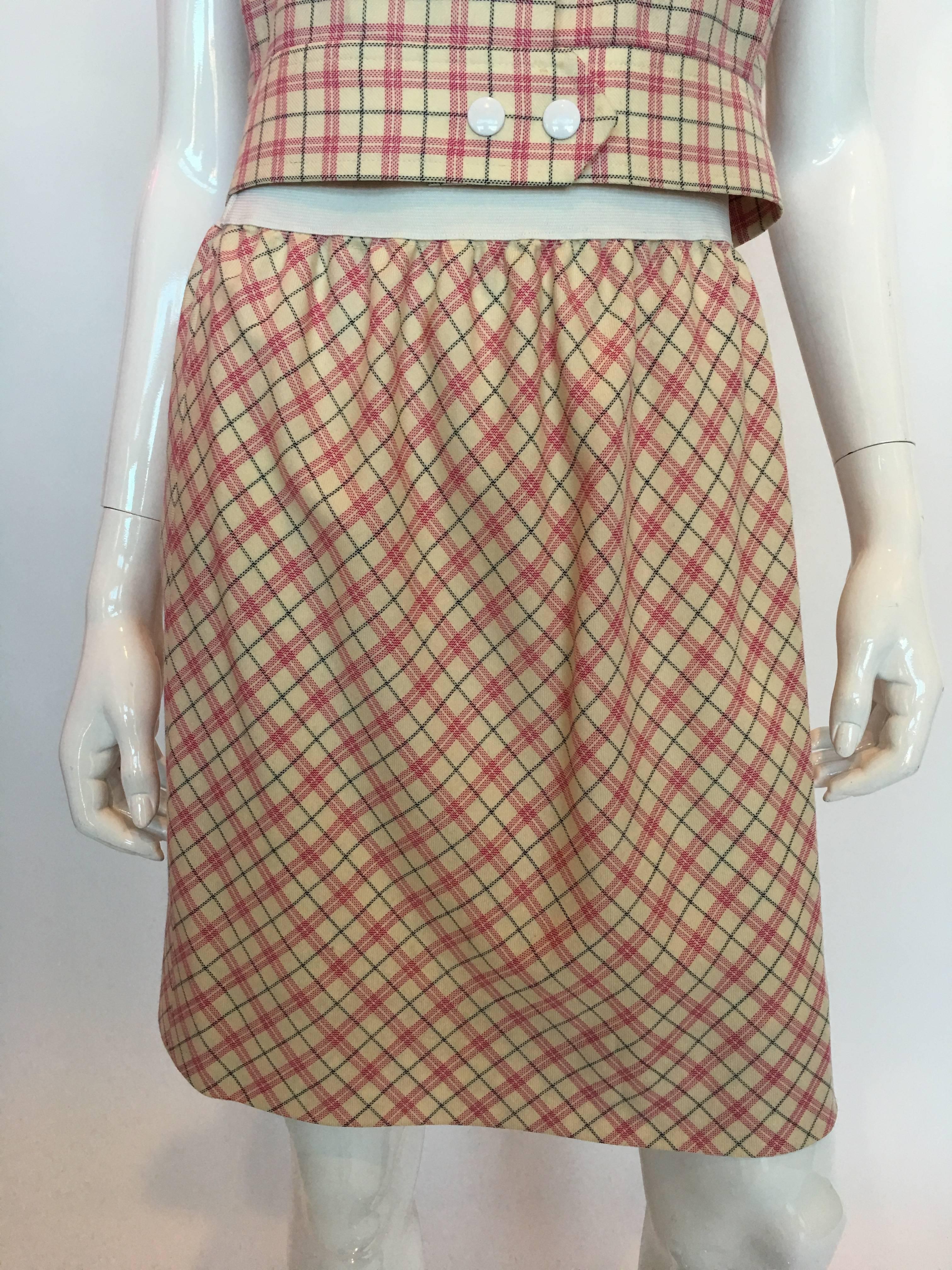 1980s Pierre Cardin Pink and White Plaid Wool Cap Sleeve Skirt Suit

Made in France
Size label 42

*All measurements taken flat*
TOP:
Shoulders - Hem to hem: 22