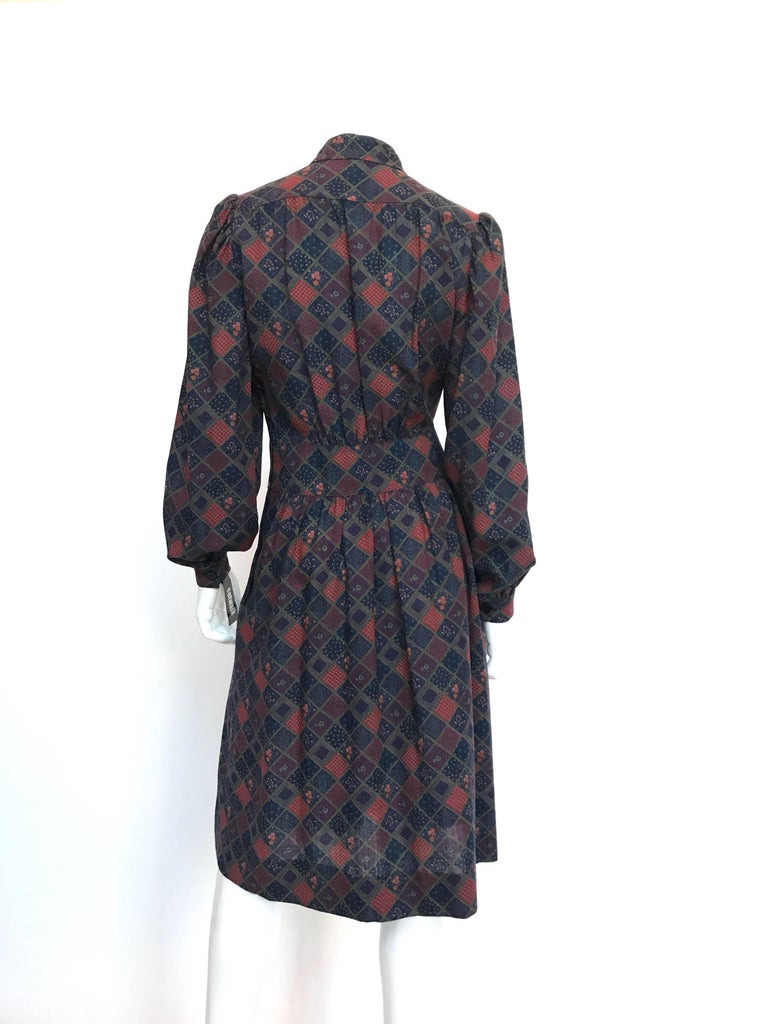 1970s Givenchy Button Front Diamond Floral Print Wool Dress with Nehru Collar 
100%  lightweight wool.
Made in Switzerland
Size label: EU 42

Measurements (taken flat):
Shoulders - seam to seam: 14