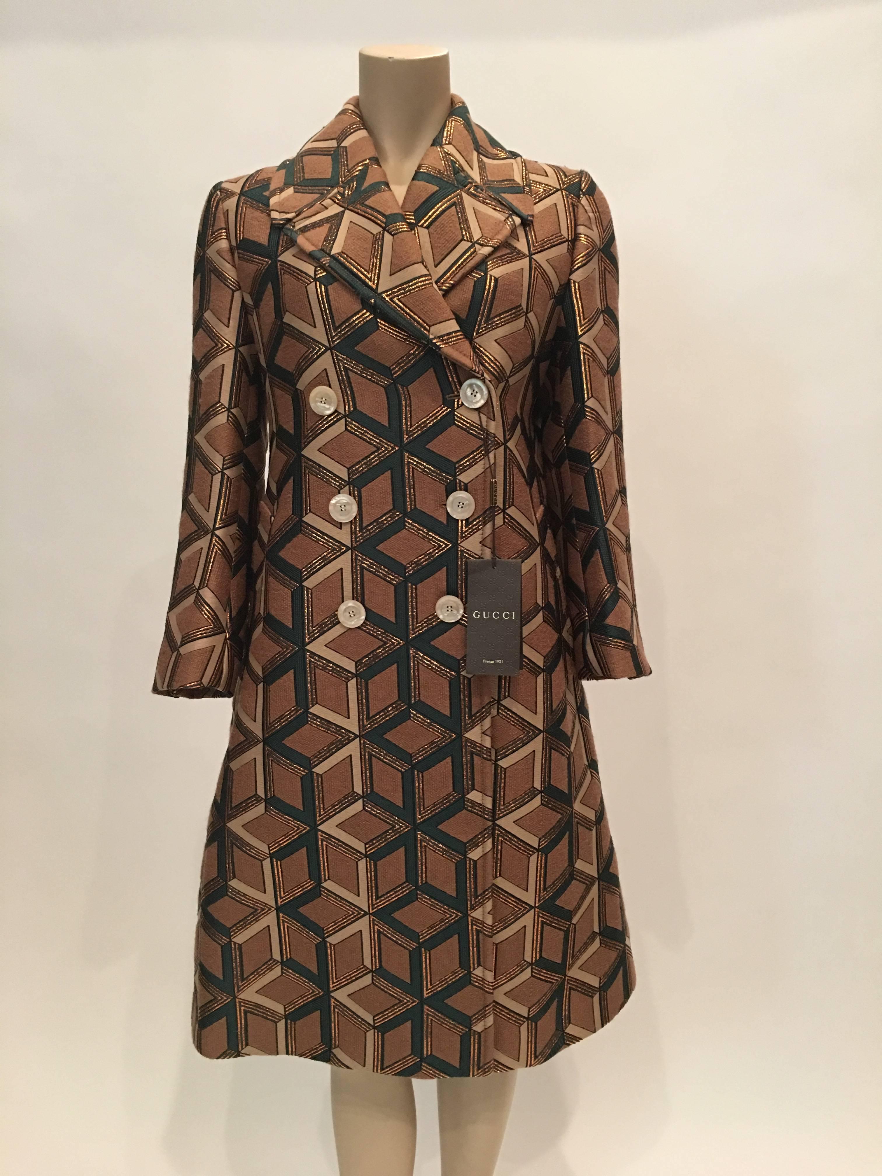 Gucci Geometric Copper & Tan Double Breasted Wool Coat with Black Silk Lining.
Made in France

Measurements : *ALL MEASUREMENTS TAKEN FLAT*
Size Label : 42
Shoulders : 15