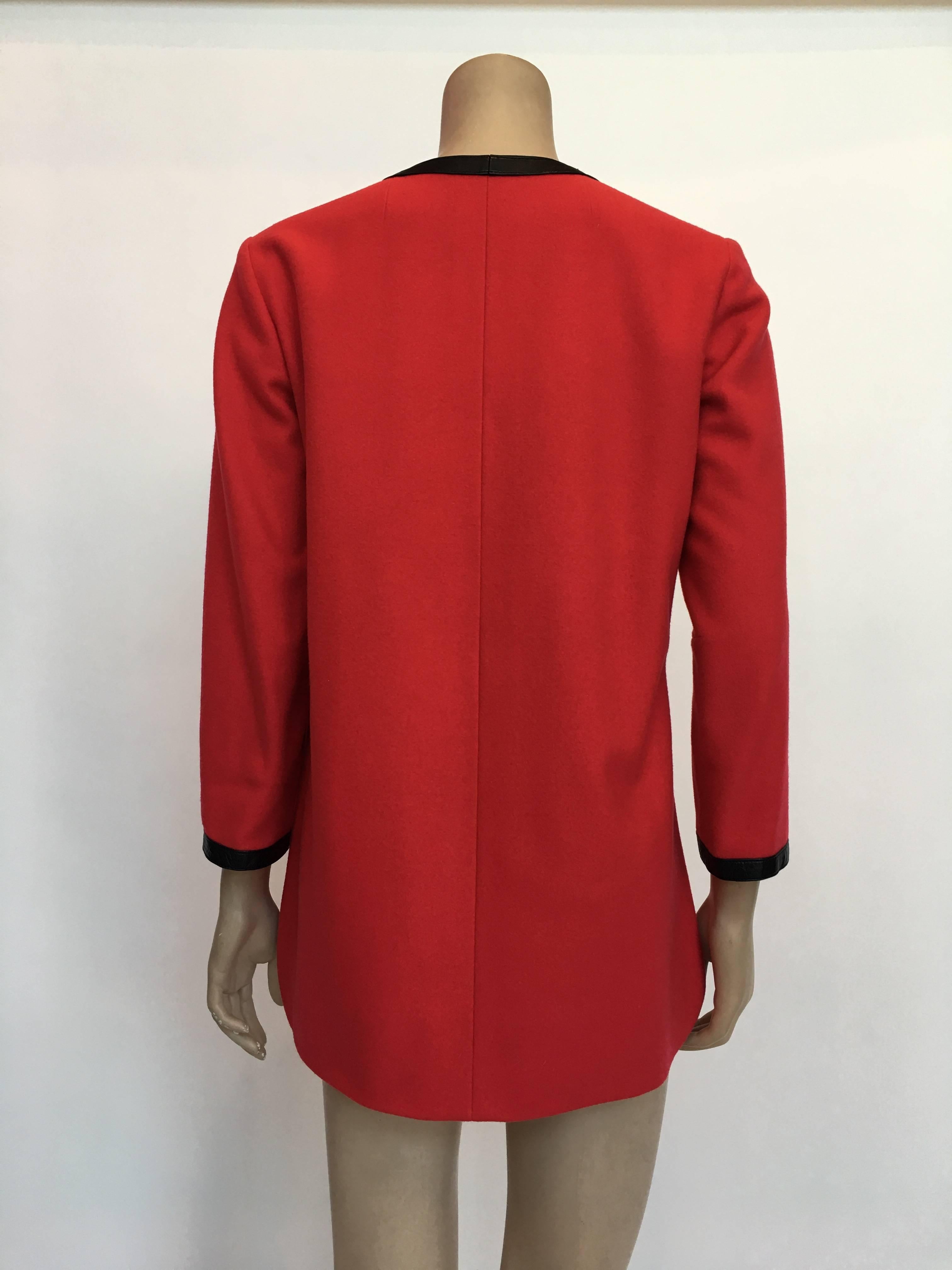 Hermes 1970's Crimson Red Tunic Top with Black Leather Strapping 
Made in France

Measurements : *ALL MEASUREMENTS TAKEN FLAT*
Shoulders : 16