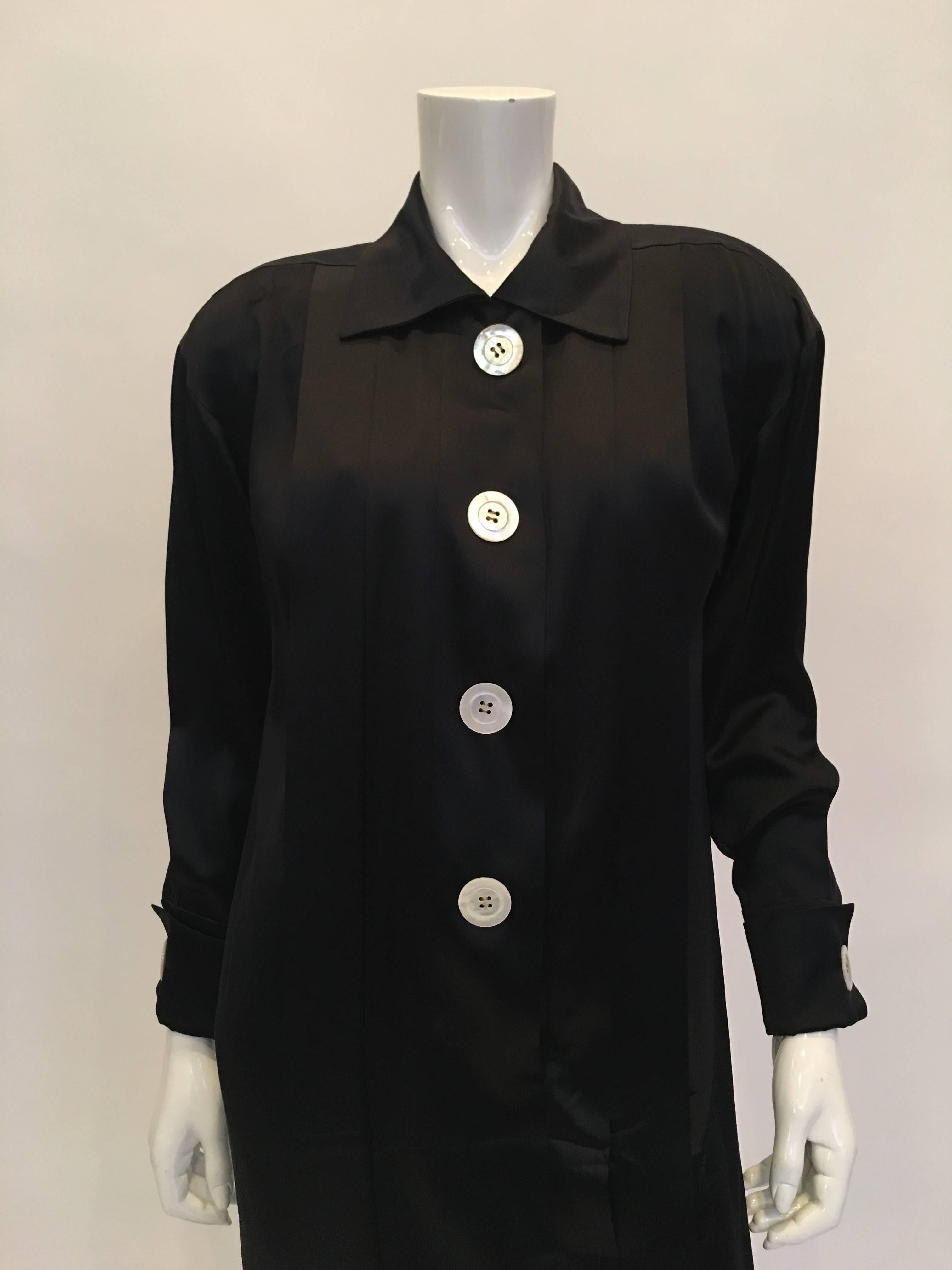 Chanel 1990's Black Satin Sheath Dress. 4 button pleated front and back with 2 hidden pockets.
Classic 90's Chanel Satin Dress.
*ALL MEASUREMENTS TAKEN FLAT*

Mannequin measures size 4 , dress fits mannequin.

Shoulder to shoulder - 19.5 inches
