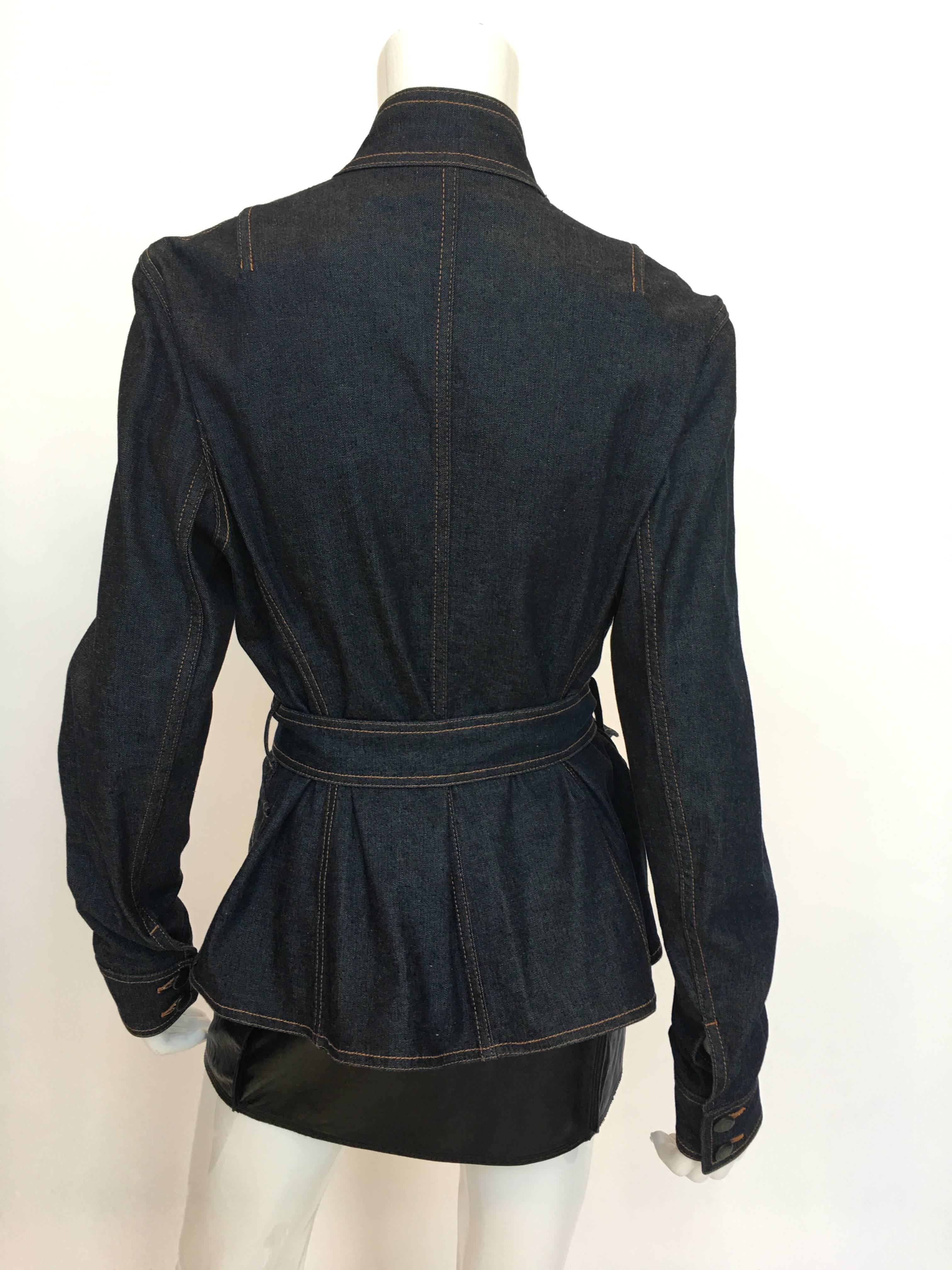 Yves Saint Laurent Rive Gauche 1990'S Denim Jacket. Double breasted with mandarin collar, 2 front patch pockets and belted. 98% cotton , 2% spandex

*ALL MEASUREMENTS TAKEN FLAT*

Shoulder to shoulder: 17