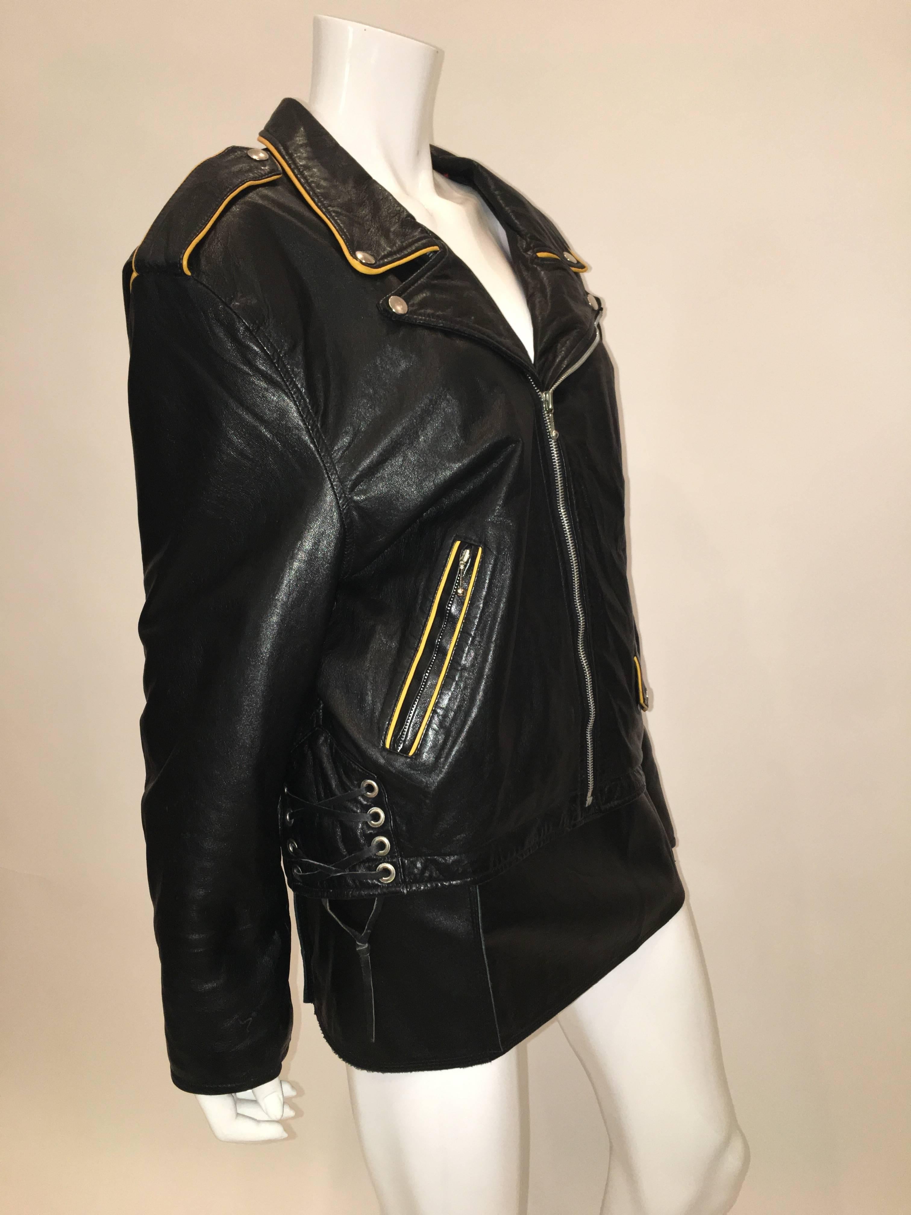 Montana Vintage 1980'S Black Leather Motorcycle Jacket with yellow leather trimming and lace up sides. Jacket has 3 zip pockets, 1 coin pocket and is fully lined. 

*ALL MEASUREMENTS TAKEN FLAT*
Size Label: Large

Shoulder to shoulder:
