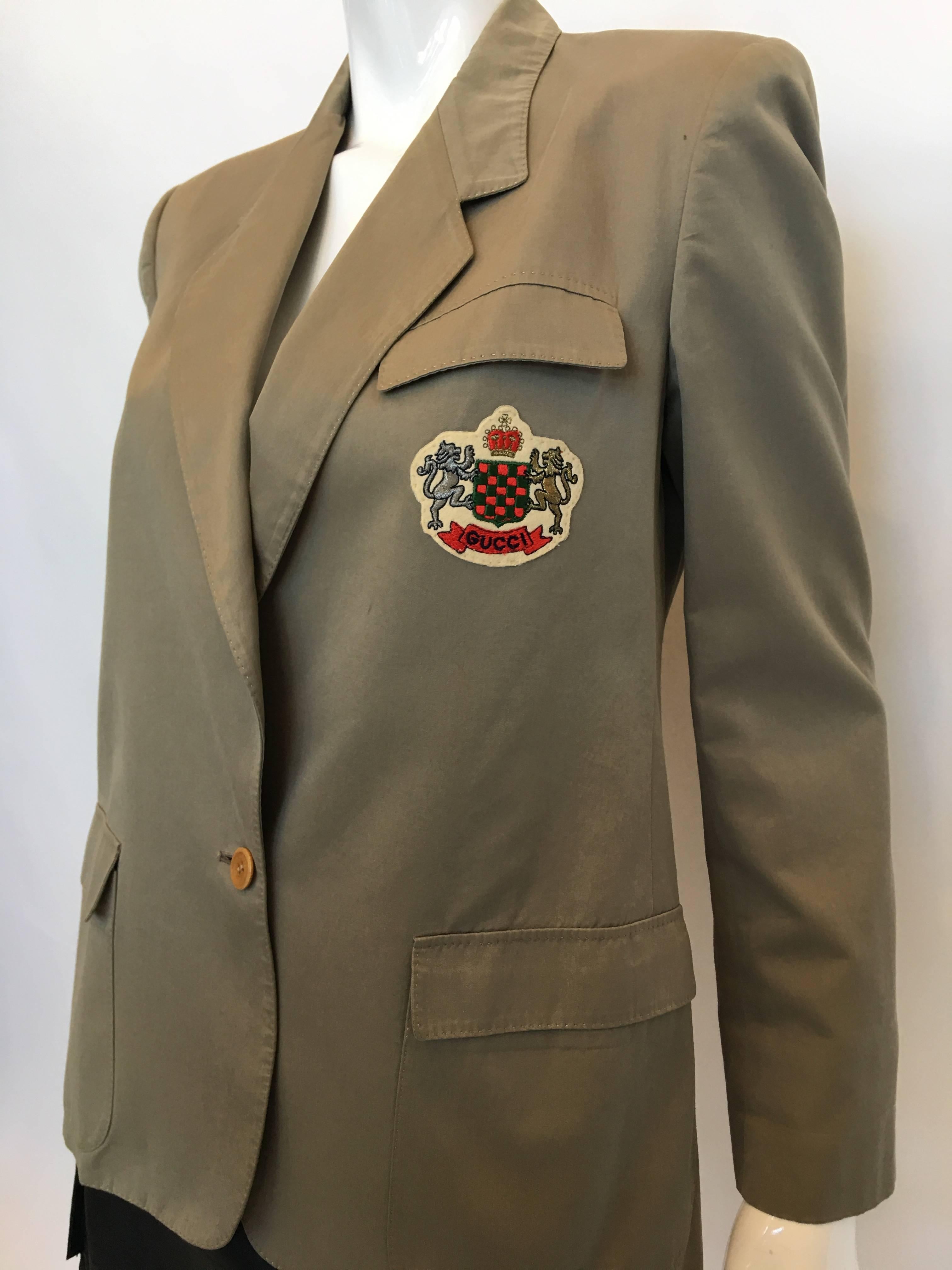 GUCCI 1970's Vintage Khaki Blazer.

*ALL MEASUREMENTS TAKEN FLAT*
Size Label: 42

Shoulder to shoulder: 16