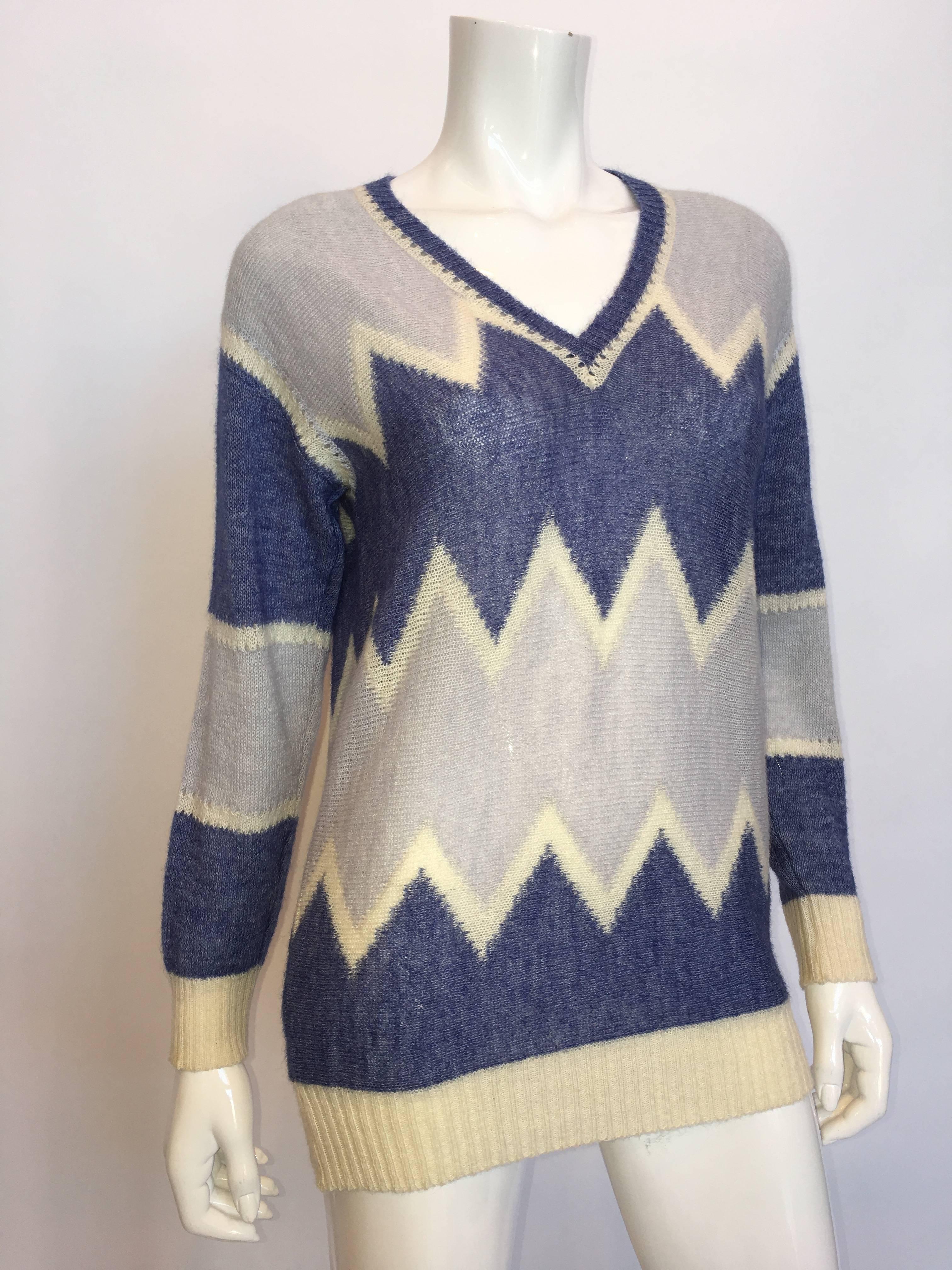 Courrèges Paris 1970's Mohair Sweater

*ALL MEASUREMENTS TAKEN FLAT*

Shoulder to shoulder: 18