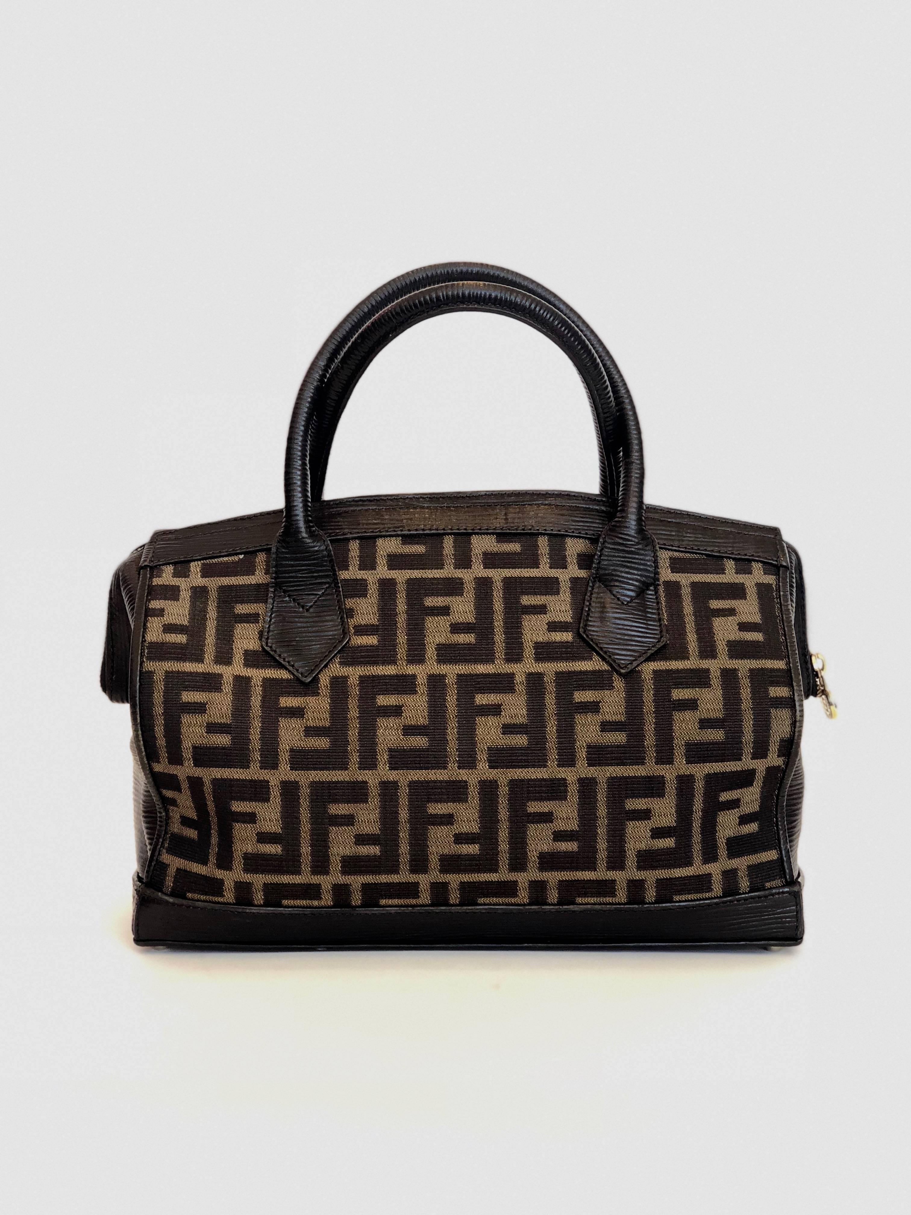 Fendi 1990's Brown and black logo bag. In good condition with no apparent wear.

*ALL MEASUREMENTS TAKEN FLAT*
Length: 11