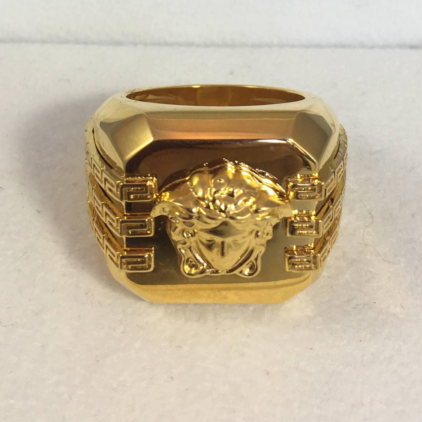 Versace Goldtone Monogram Jellyfish Ring in box with tag.

Size 10 1/2.

New Condition: New, never used. 
