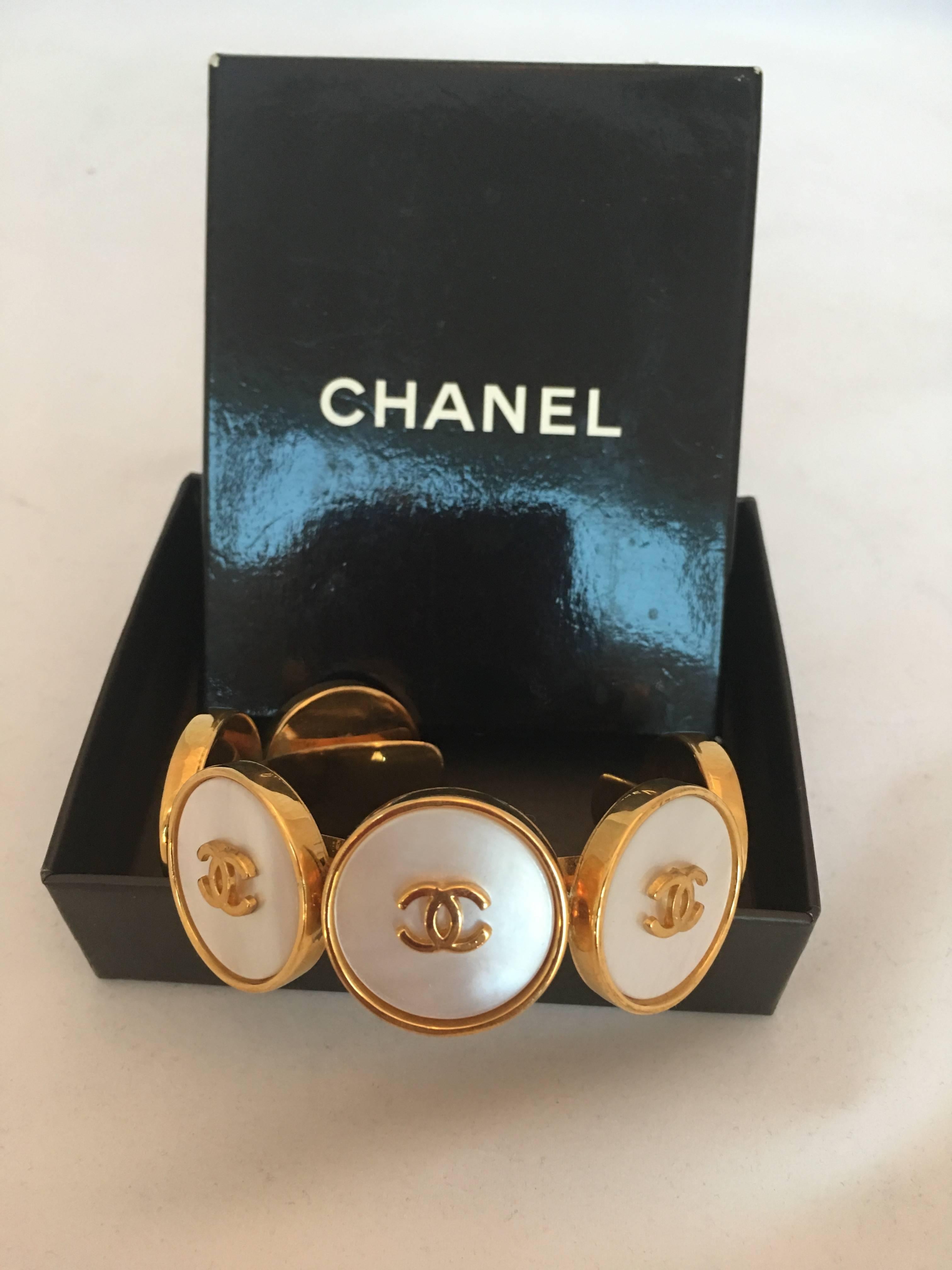Chanel 1980's Mother of Pearl & Gold Tone Cuff Bracelet

Width: 1