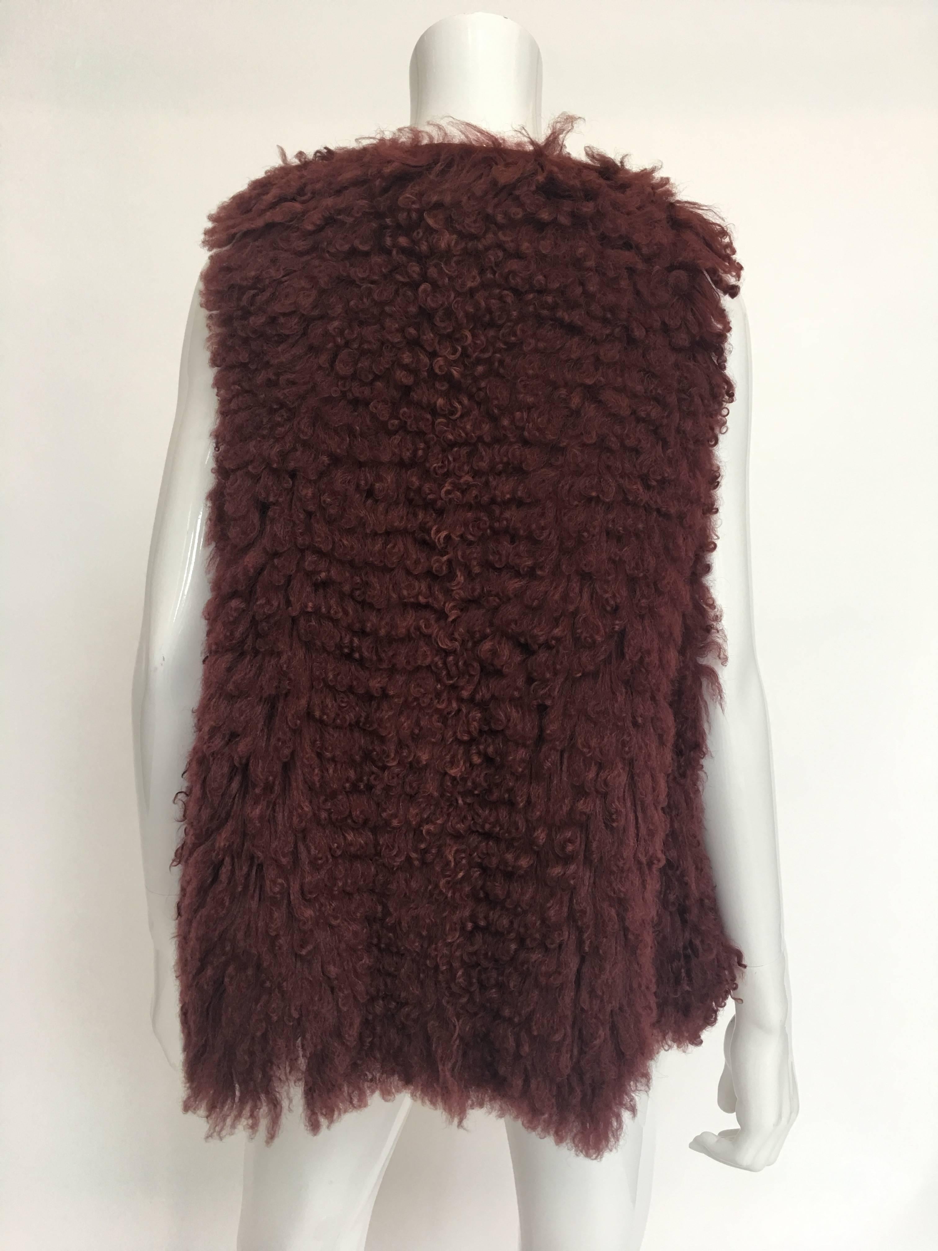 1970s Fendi for Bergdorfs Maroon Curly Lamb Vest w/ Large Armholes

Shoulders - seam to seam: 13