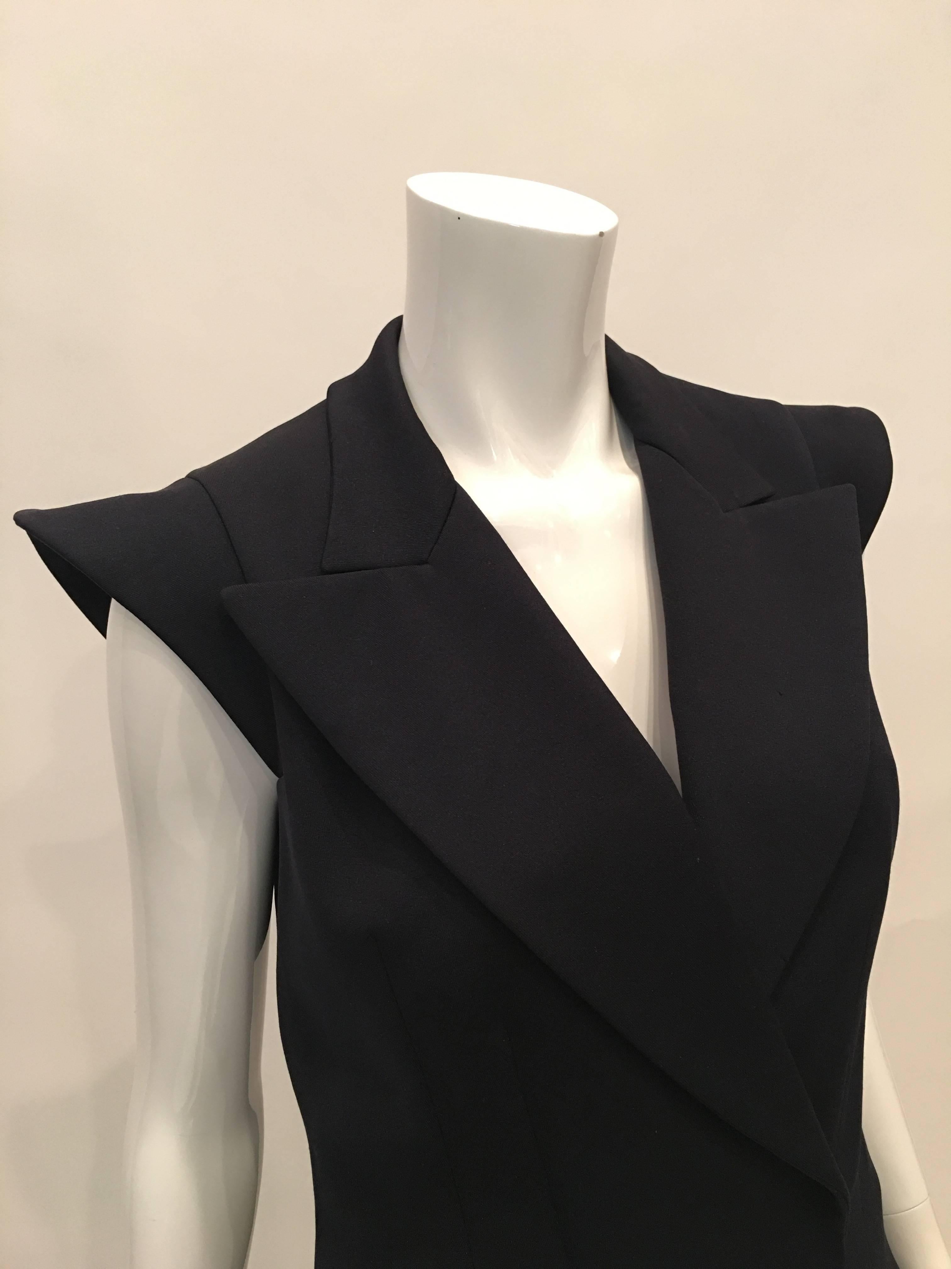 Yves Saint Laurent Wool Midnight Blue Double Breasted Vest with 2 front pockets.

Size Label : 38 (French)

*ALL MEASUREMENTS TAKEN FLAT*

Mannequin measures size 4 , vest fits mannequin 
Shoulder to shoulder - 13 inches
Armpit to armpit - 17