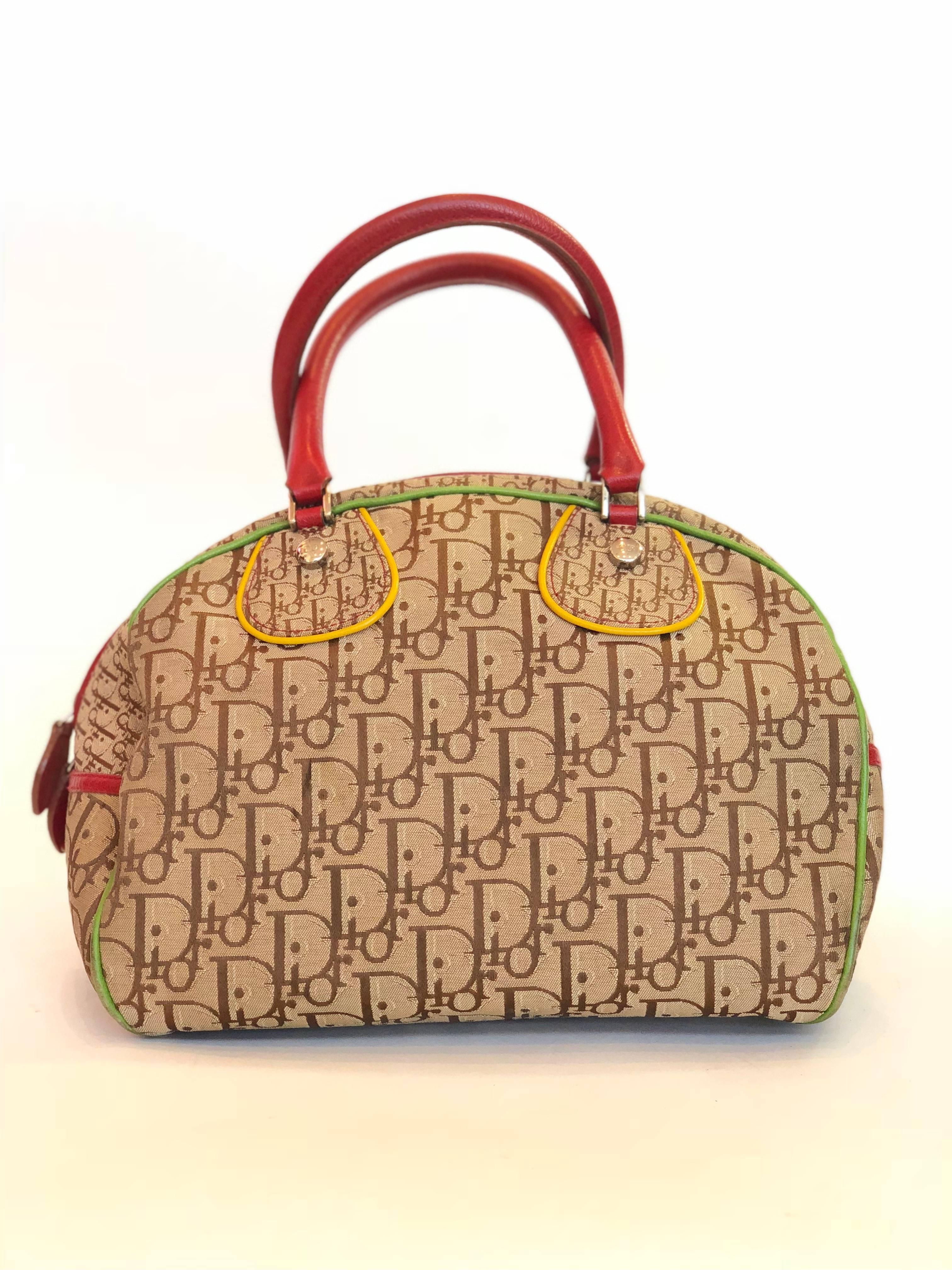 Christian Dior Iconic Monogram Canvas Rasta Satchel Bag Limited Edition with multi color leather trim. Double rolled handles and double zipped top. Chocolate brown nylon lining. 

*MEASUREMENTS*
Height: 8
