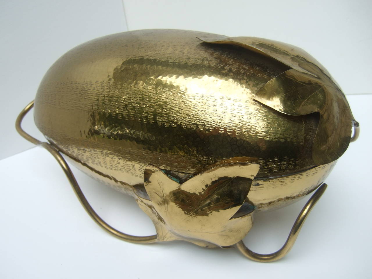 Avant-garde artisan brass metal decorative gourd designed by Lavorazione Amano Made in Italy

The unique Italian handmade brass metal gourd is designed in the shape of a large watermelon. The metal gourd is decorated with large soldered leaves & a