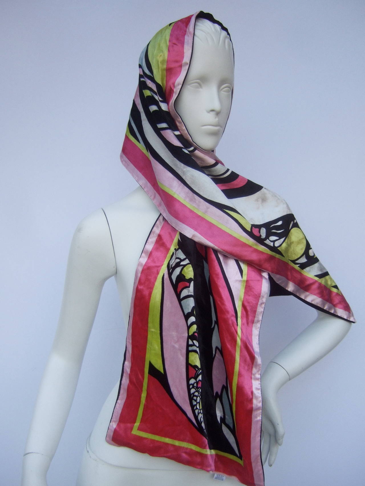 Emilio Pucci Luxurious velvet print oblong scarf Made in Italy
The chic Italian scarf is designed with a collage of bold graphics
The vibrant graphics range from fuchsia pink, pale pink, ice blue, lime green black & white  

The vivid bold