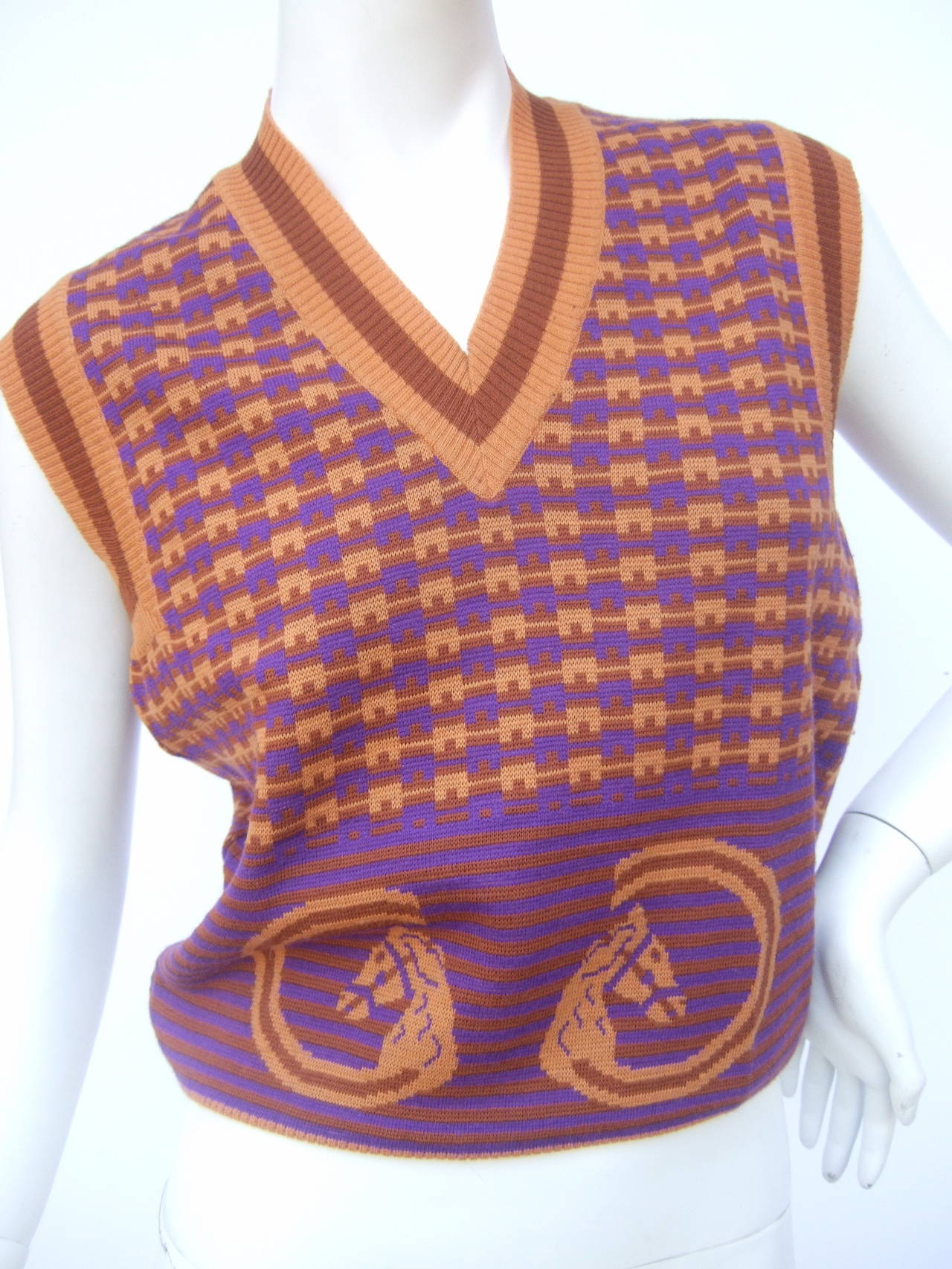 Gucci Italy Equestrian design wool knit sleeveless sweater vest c 1970
The mod retro wool knit sweater is designed with a pair of horse
heads on the front. The horse figures are designed in the shape
of Gucci's G.G. iconic initials 

The