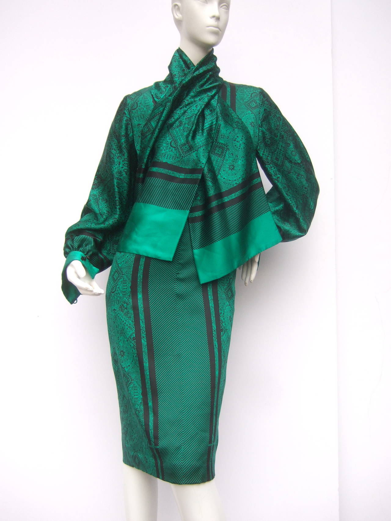 Christian Ruperto Emerald green silk charmeuse dress & scarf c 1980s
The chic dress is designed with luminous green silk combined with
bold black stripes & intricate subtle floral graphics 

The elegant dress is paired with a long voluminous