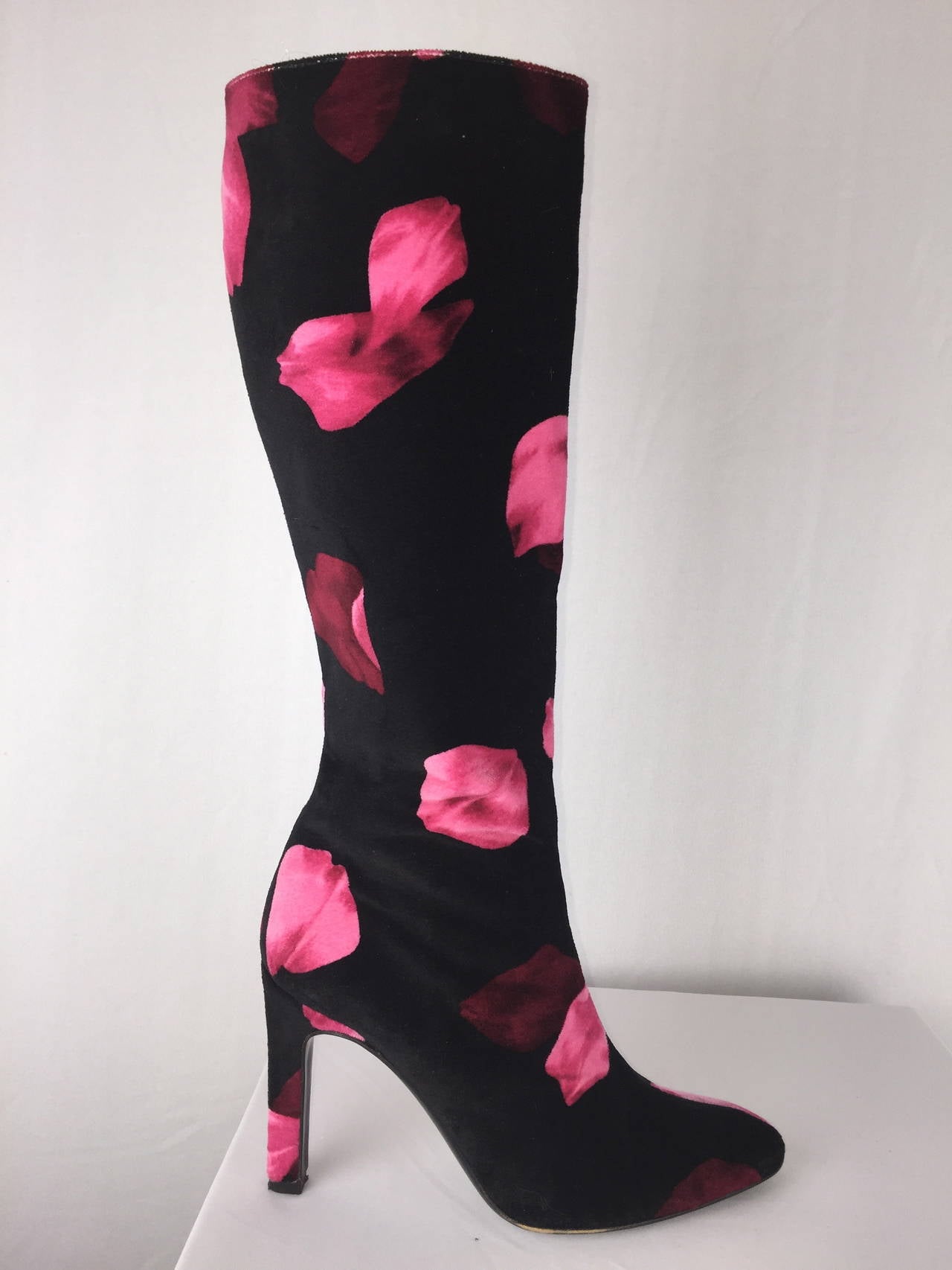 Gorgeous black velvet boots printed with red and pink rose petals from Valentino's Spring-Summer Collection of 1997.  Full leather lining. Knee high. 
4 inch wrapped heel embellished with gold metal strip. 

 Italian size 37.  U.S. size