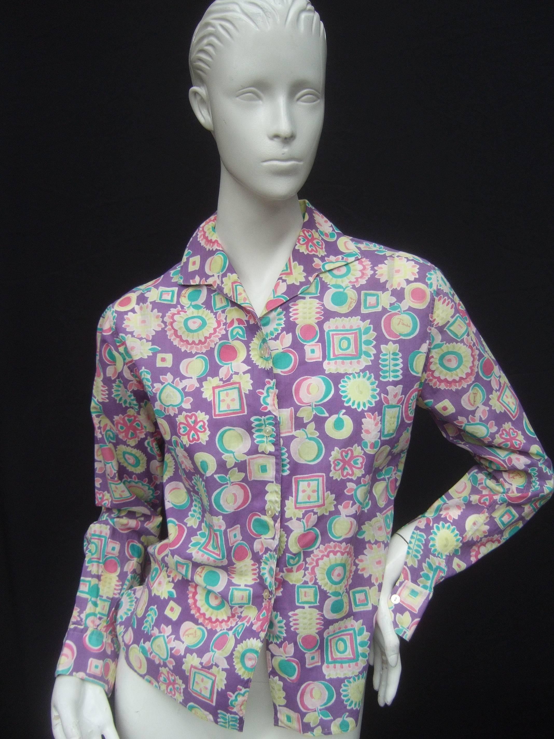 Emilio Pucci Cotton pastel print blouse Made in Italy
The charming retro blouse is designed with color
block floral and fruit graphics

The collage of fruits and flowers are set against 
a lavender purple background. Emilio's script
name is