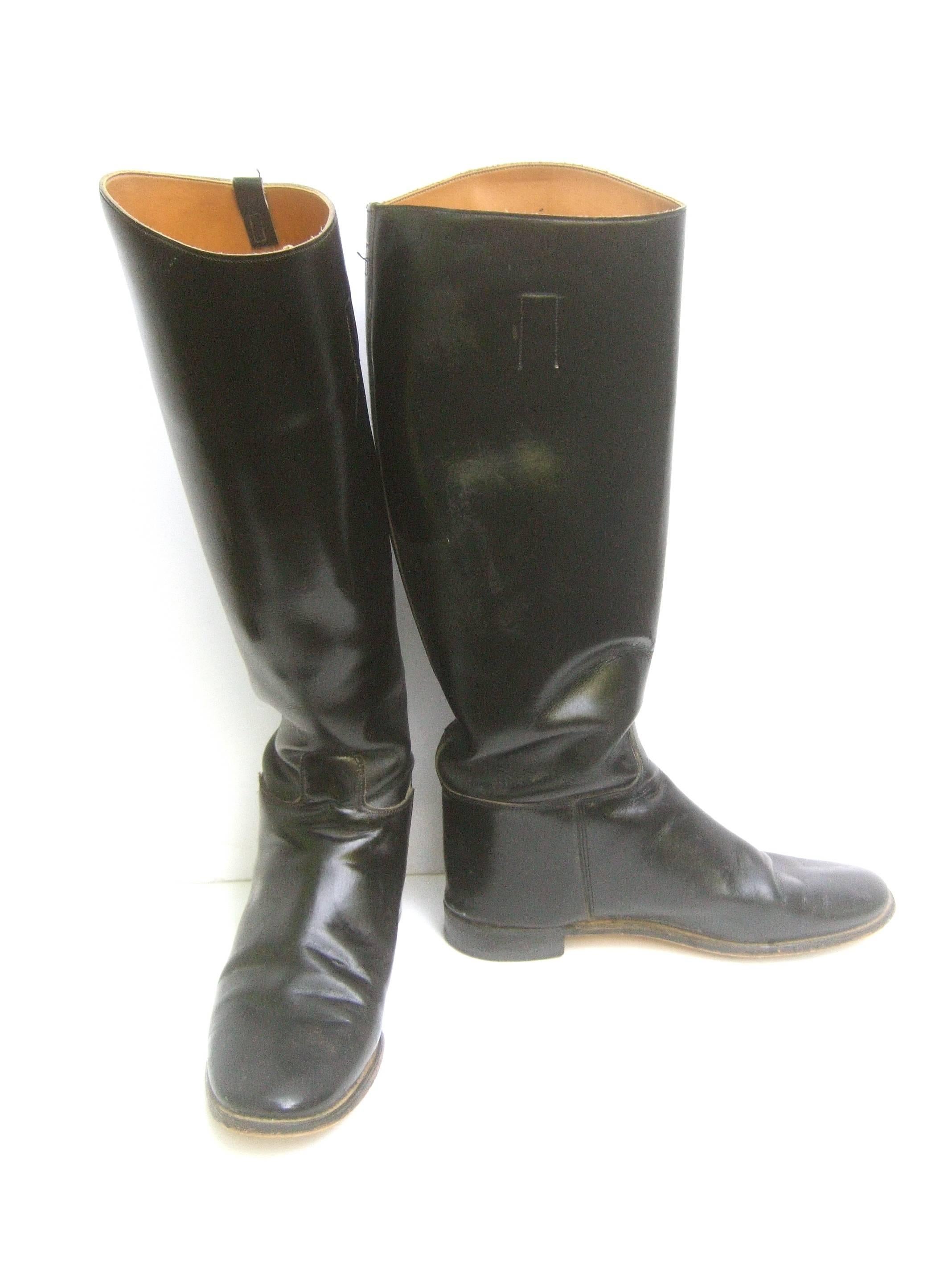 Men's English equestrian black leather riding boots US Size 8.5
The classic black leather riding boots are designed
by Marlborough of England 

They make a great accessory for hunting, jumping & polo
Paired with the boot hook claw in order