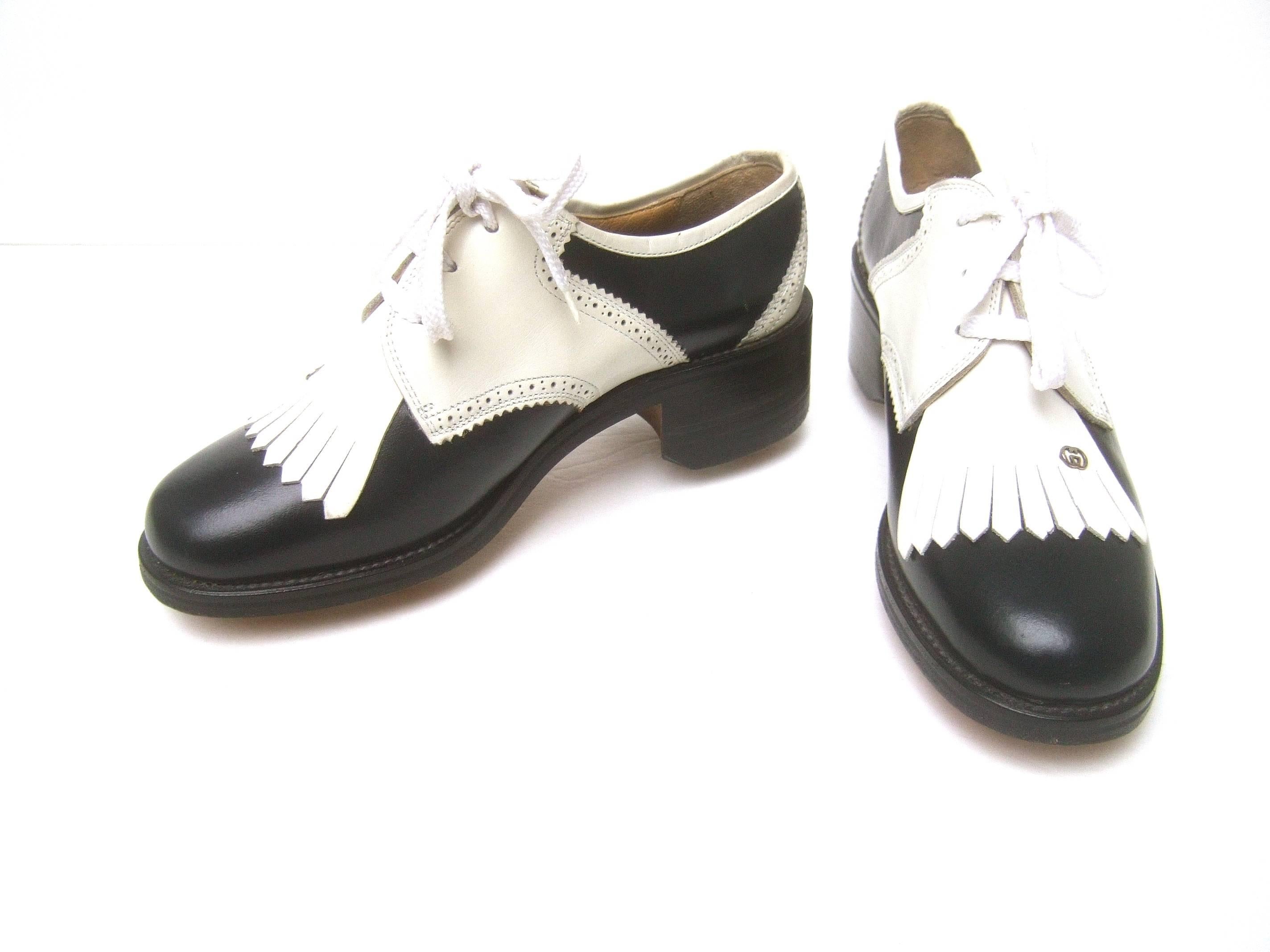 Gucci Women's leather brogue golf shoes Size 36 B
The rare stylish golf shoes are designed with 
contrasting black & white leather 

The front of each shoe is adorned with Gucci's
silver metal interlocked G.G. initials 

The classic designer