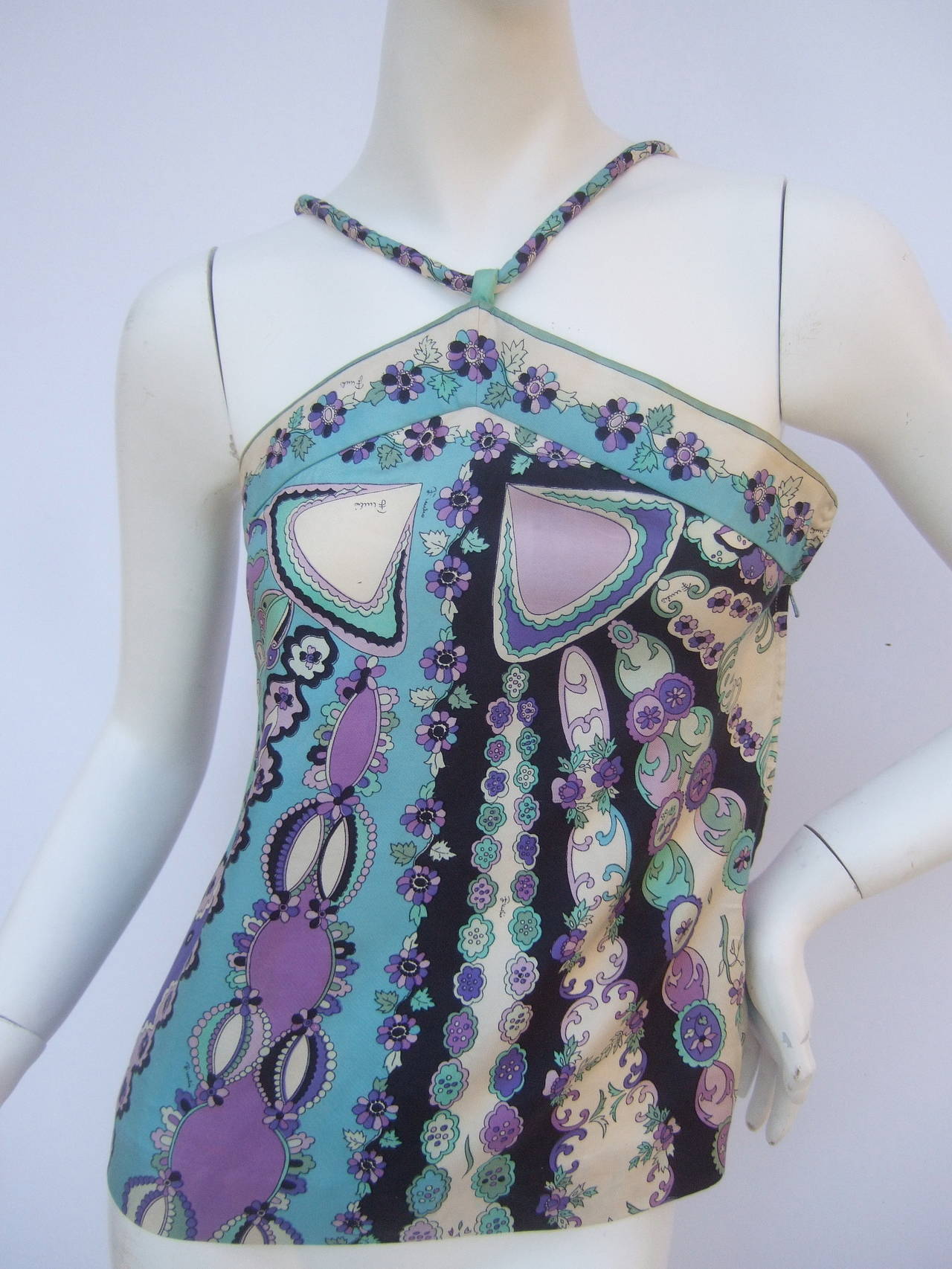 Emilio Pucci Pastel silk camisole top for Saks Fifth Avenue c 1970
The vintage Italian silk top is designed with a collage of vibrant
pastel colors; lavender, violet, aqua, turquoise with black & white

Within the pastel hues are a profusion of