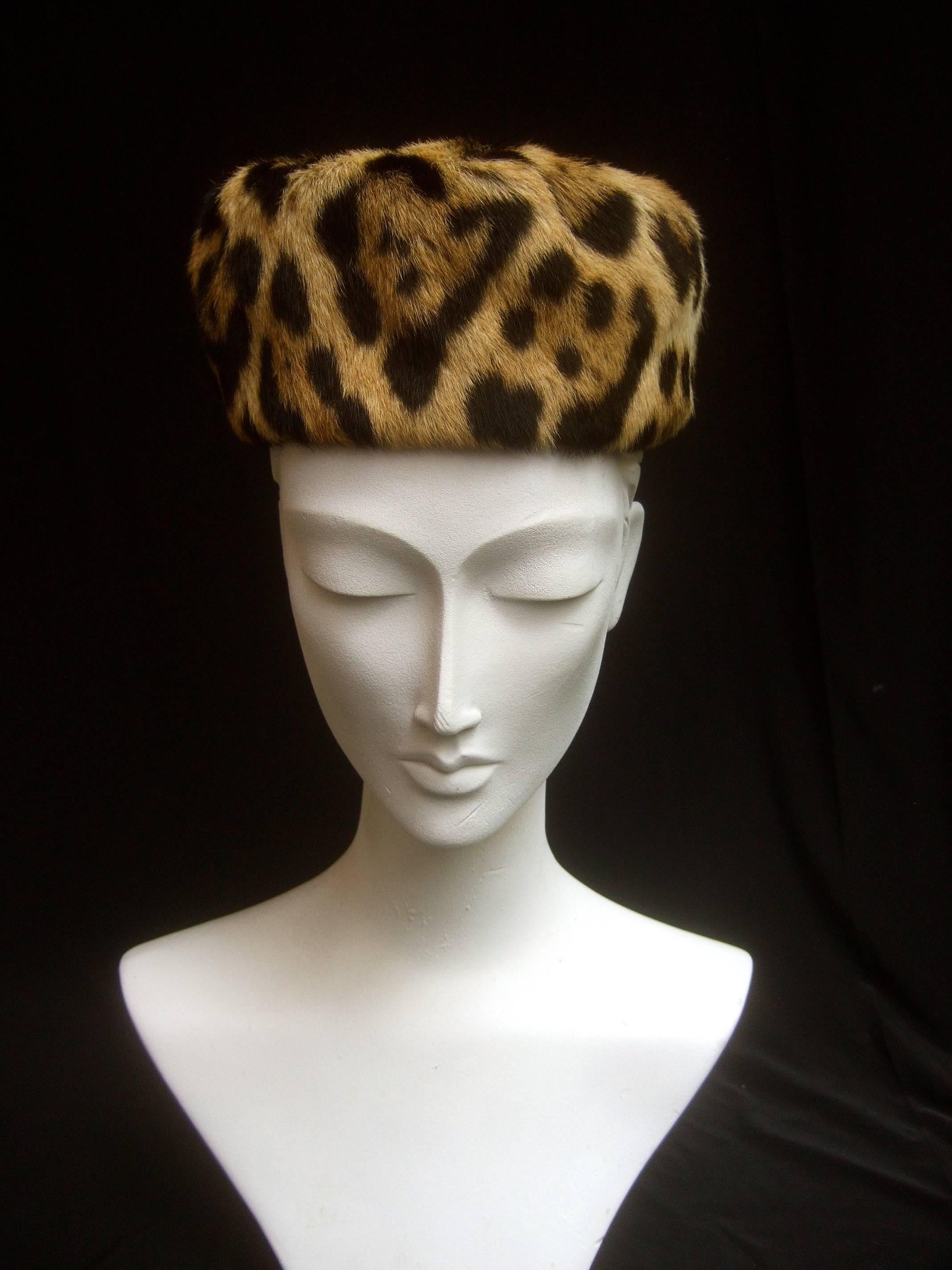 Saks Fifth Avenue Stamped animal print fur pill box hat c 1960
The chic retro stamped animal print fur hat makes 
a stylish bold accessory 

Labeled: Saks Fifth Avenue 
The interior head size circumference measures 20 inches 
