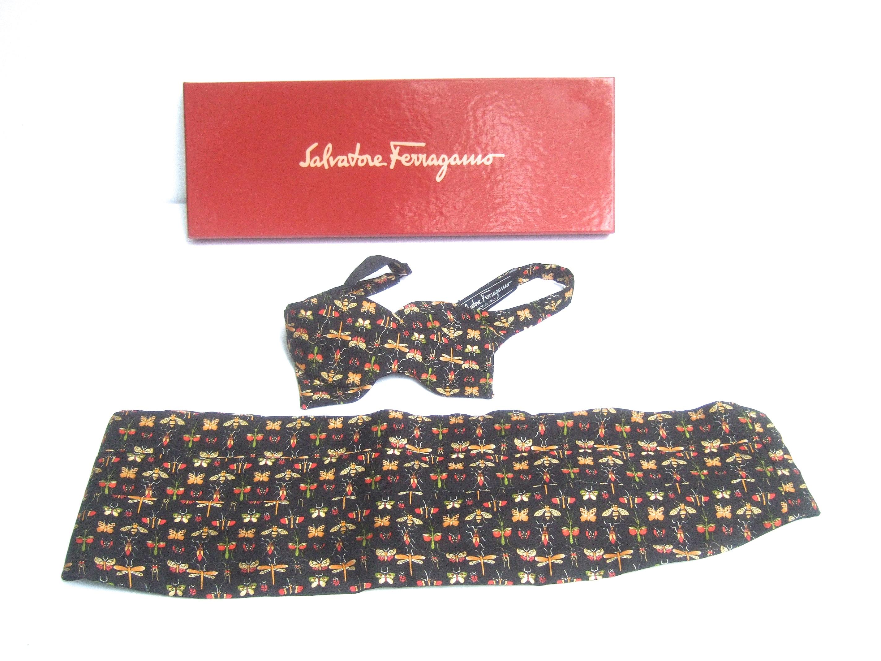 Salvatore Ferragamo Italian silk insect print cummerbund & bow tie set in box c 1990
The stylish silk bow tie & cummerbund are illustrated with a collection 
of insects; bees, butterflies, dragonflies & varies species of flying insects 
set against