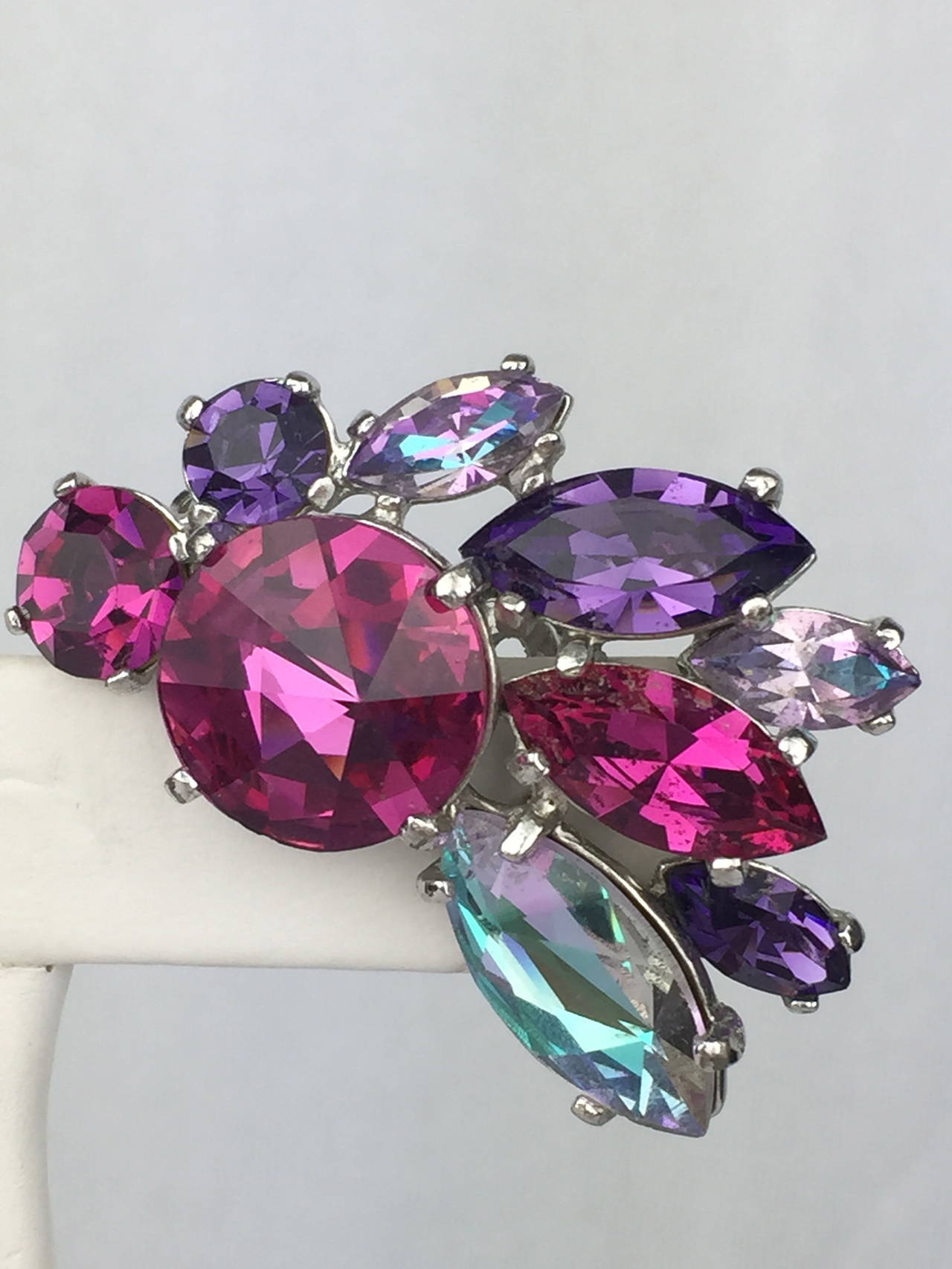 Outstanding fuchsia pink and purple Schiaparelli vintage earrings from the early 1960's.  Such an unusual color palette for Schiap and so pretty!

Length:  1.5 inches.  Width: 1.25 inches

The condition is excellent.  These earrings are very