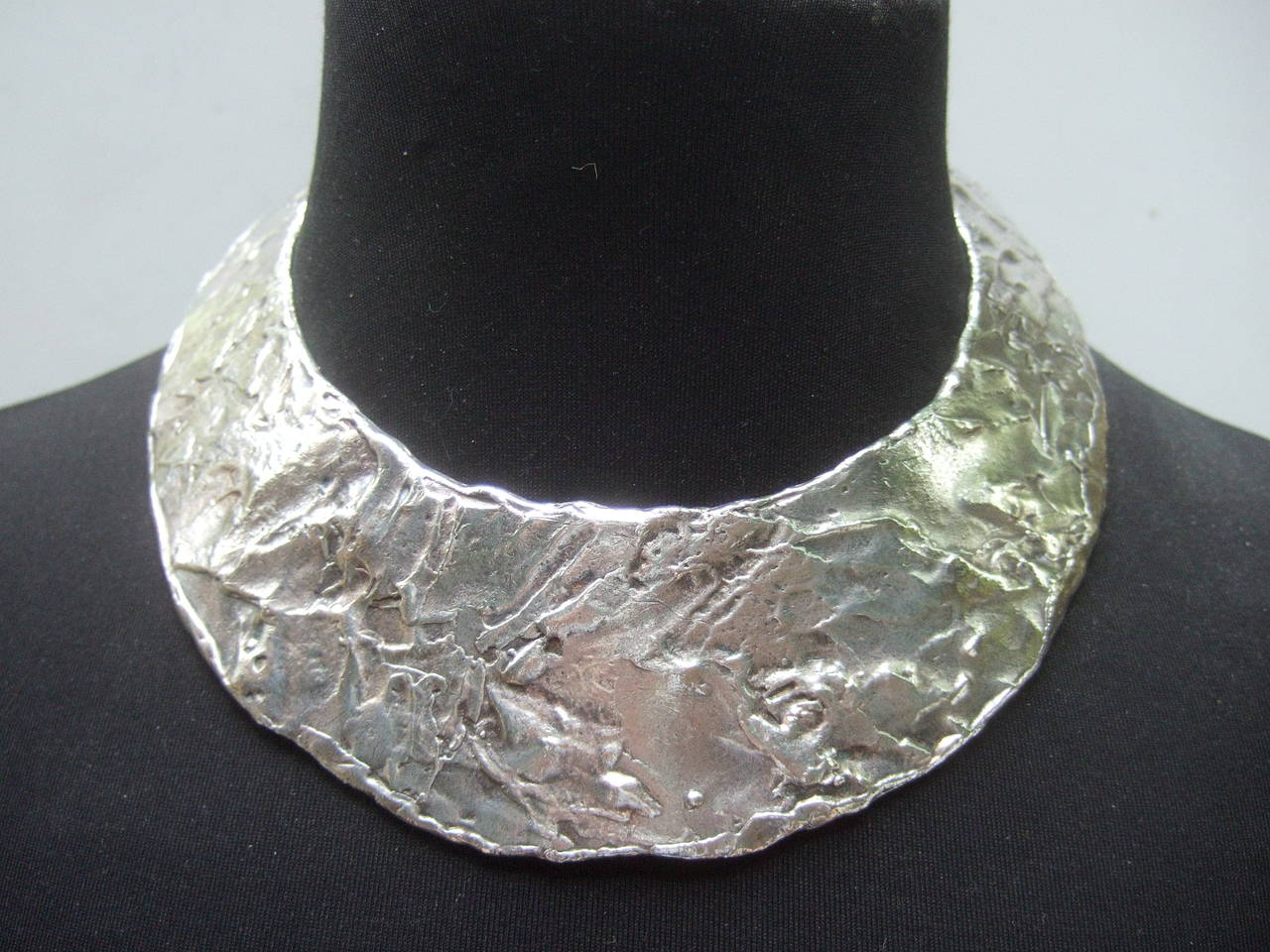 ***RESERVED FOR WENDY SALE PENDING***

Biche de Bere Paris Modernist style hammered metal collar necklace c 1990
The severe bold avant-garde necklace is designed with a textured 
abstract finish. The brutalist style silver metal collar necklace