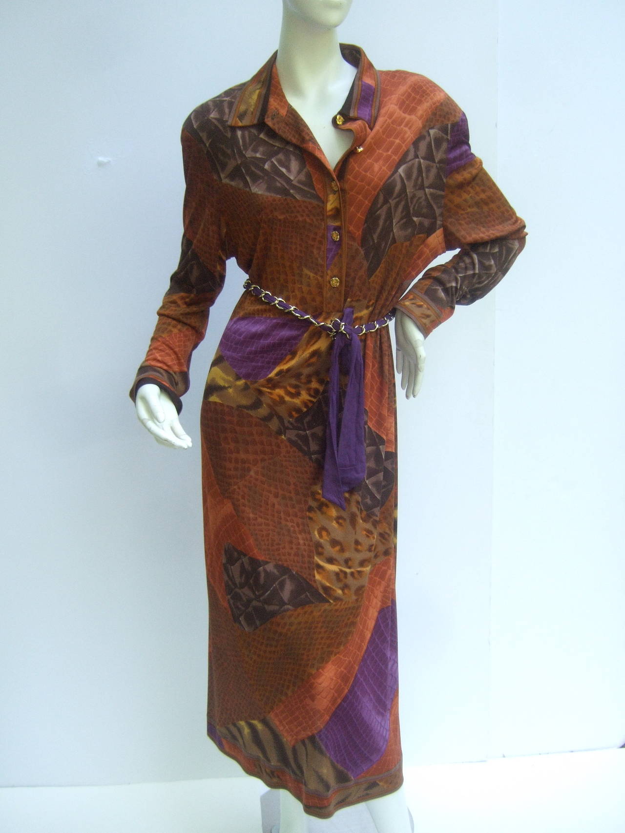 Leonard Paris silk jersey print dress Made in Italy c 1990s
The stylish dress is designed with a collage of autumn colors
The vibrant print is illustrated with a myriad of reptile skin 
and exotic animal fur print graphics. Leonard's name is