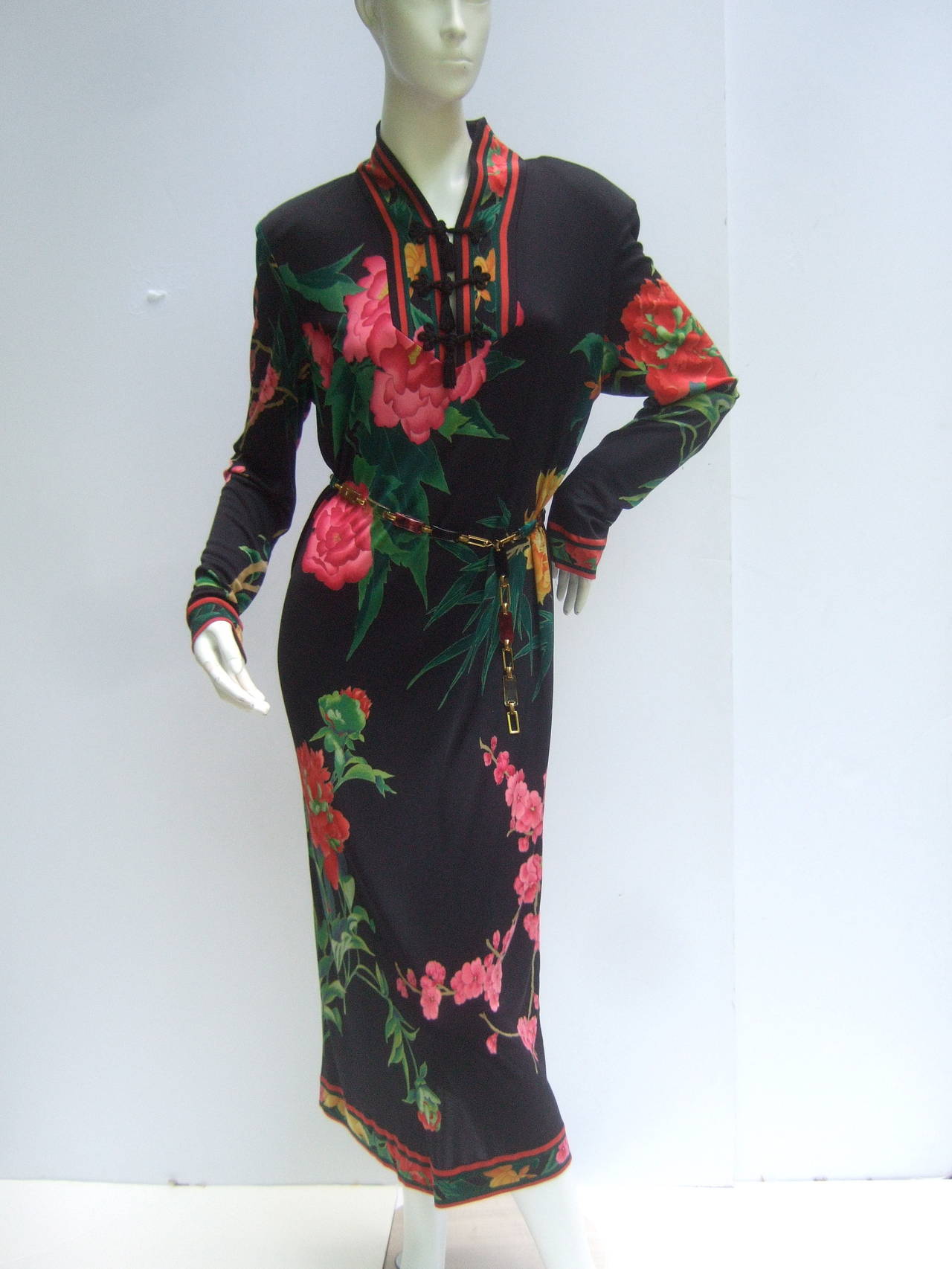 Leonard Paris Silk jersey floral print dress Made in Italy c 1980s
The elegant designer dress is illustrated with a field of lush flower
blooms that illuminate against the black silk jersey background

The collar is designed with three sets of black