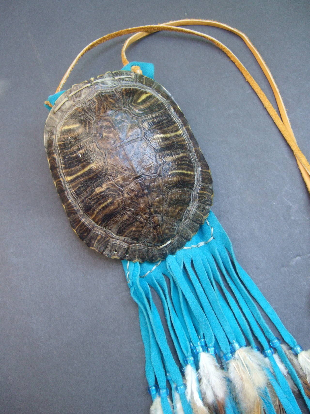 American Indian genuine turtle shell shoulder bag c 1970s
The unique artisan handbag is designed with a turtle
shell that serves as the small handbag interior

The handmade turtle shell is strung together with
both the top & bottom shell.