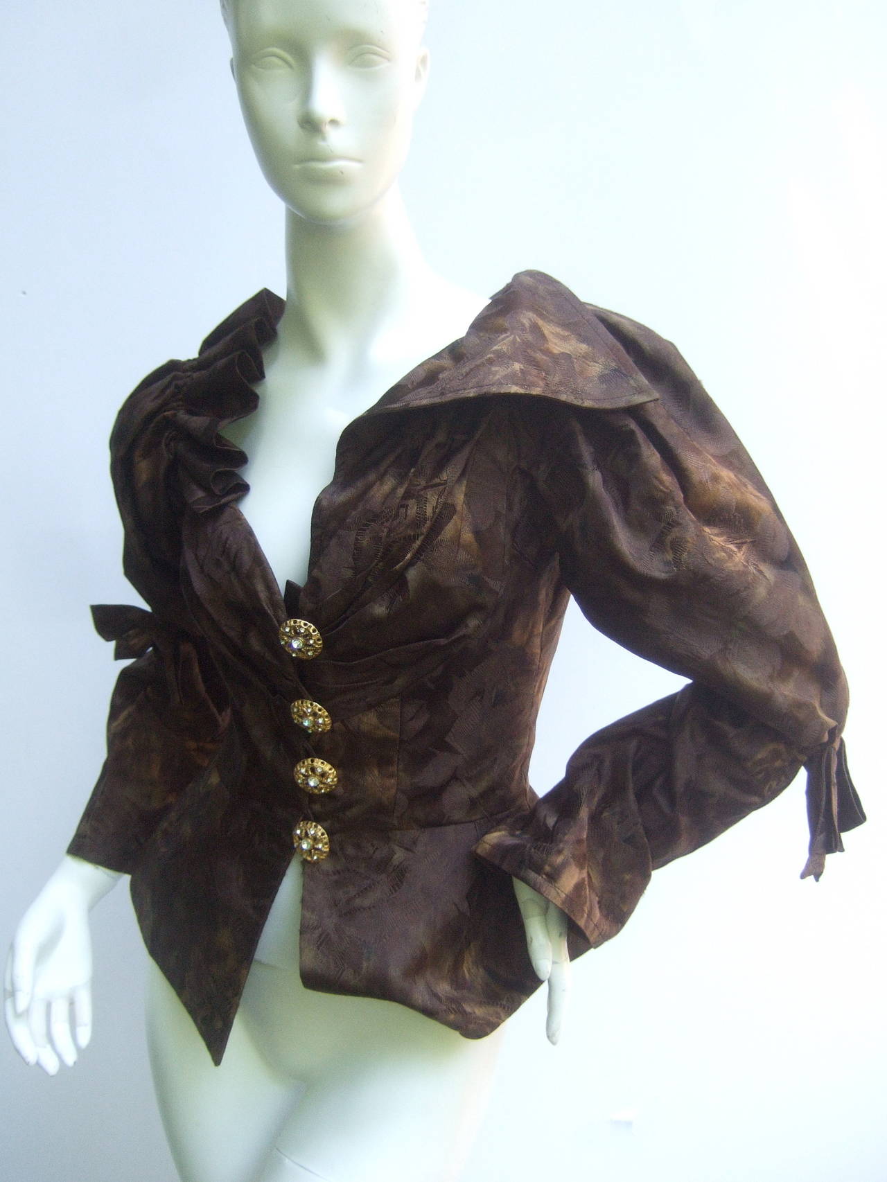 Christian Lacroix Paris Fabulous brown silk jacket Size 38
The edgy high fashion jacket is designed with luxurious
silk brocade in a myriad of copper brown hues with 
small black patches

One side of the dramatic collar has ruched pleating
the