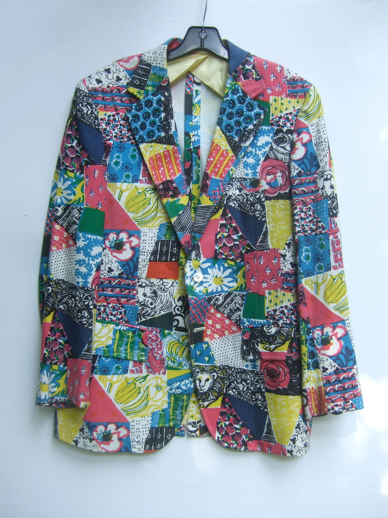 Lilly Pulitzer Men's whimsical print resort jacket c 1970s
The tropical jacket is designed with a collage of vibrant 
graphics. The color block patches are illustrated with
vibrant flower blooms in a myriad of eyecatching colors 

Concealed