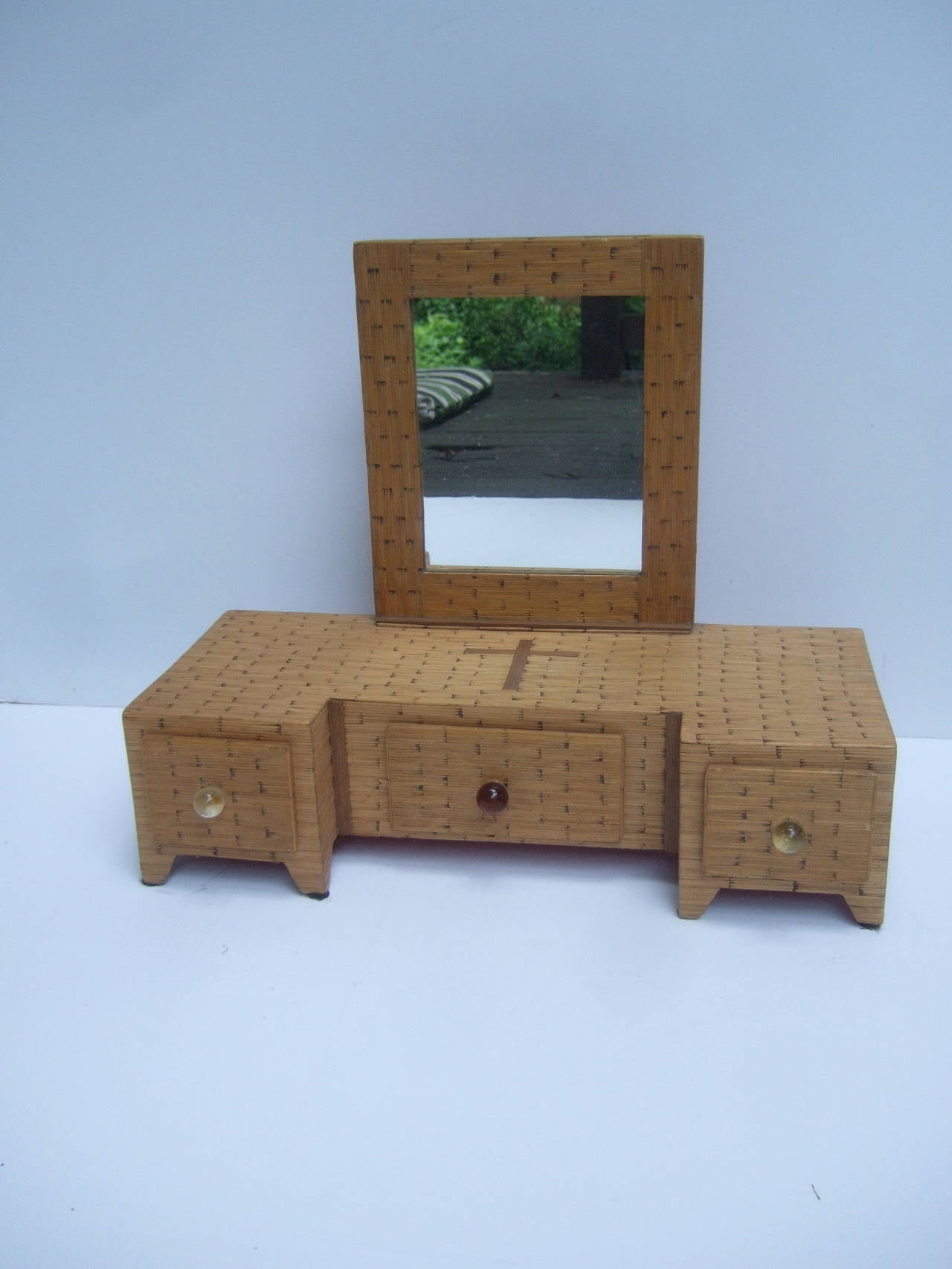 1930s Handmade tramp art match stick diminutive vanity case
The unique compact size vanity case is completely designed 
with wood match sticks. The rows of match sticks frame
the small mirror, cover the top & sides The three drawers