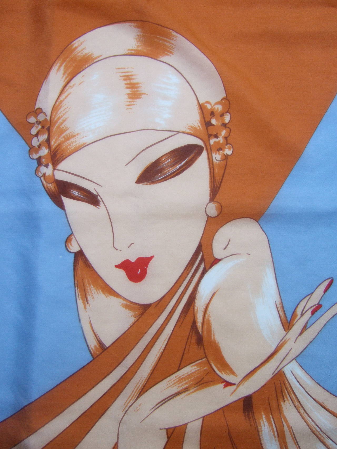 Pierre Cardin Art Deco inspired stylized woman silk scarf c 1970s
The vintage Italian silk scarf is illustrated with an elegant woman
holding a dove

The copper brown colors illuminate against the ice blue
silk background. The hand rolled scarf