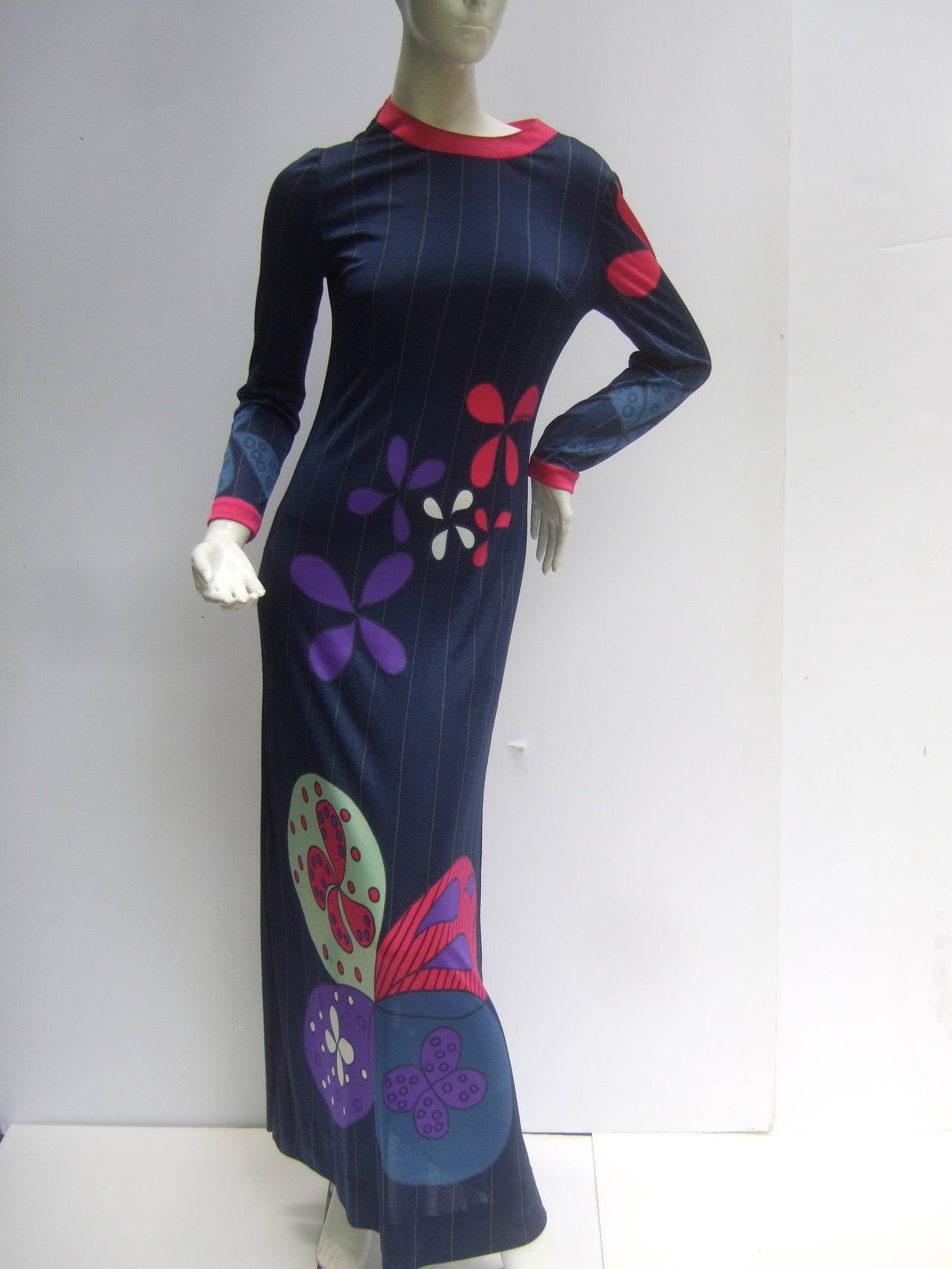 Louis Feraud Paris Fabulous mod jersey knit print maxi gown c 1960s
The chic vintage knit gown is infused with lucious colors amid
floral pedals and abstract graphics. The sexy slinky knit gown  
epitomizes the flower power & freedom of swinging