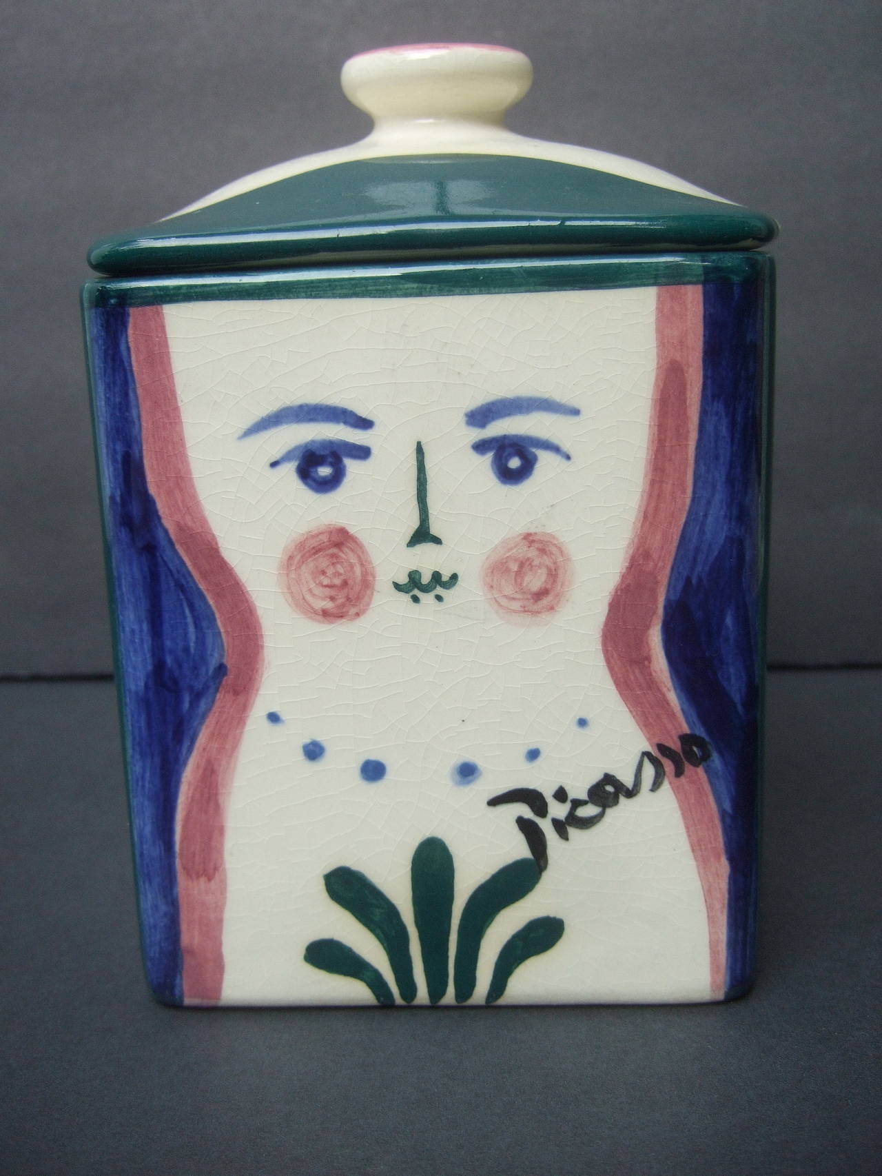 Picasso for Pidilla Pottery ceramic jar Made in Mexico 1944
The mid century diminutive ceramic jar is illustrated with an
authorized Picasso design. Commercially offered thru a line 
of ceramics that were licensed and manufactured by Pidalla