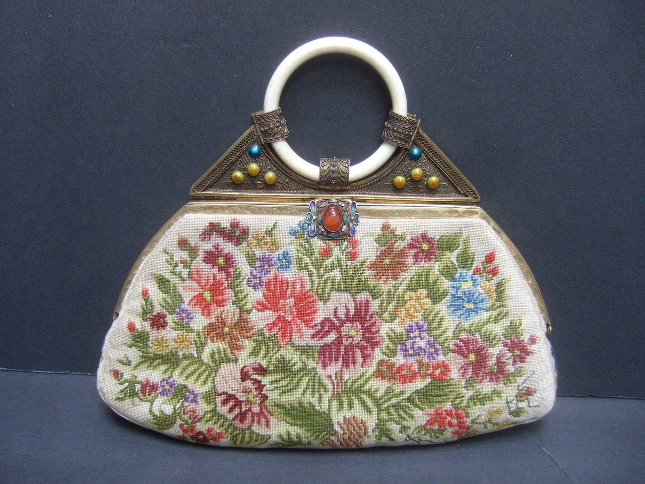 

Exquisite petit point jeweled floral evening bag.

So 1920s flapper style!

This exotic flower design purse is embellished 
with a a field of intricately stitched lush blooms.

The flowers are on both the front and back
exterior sides