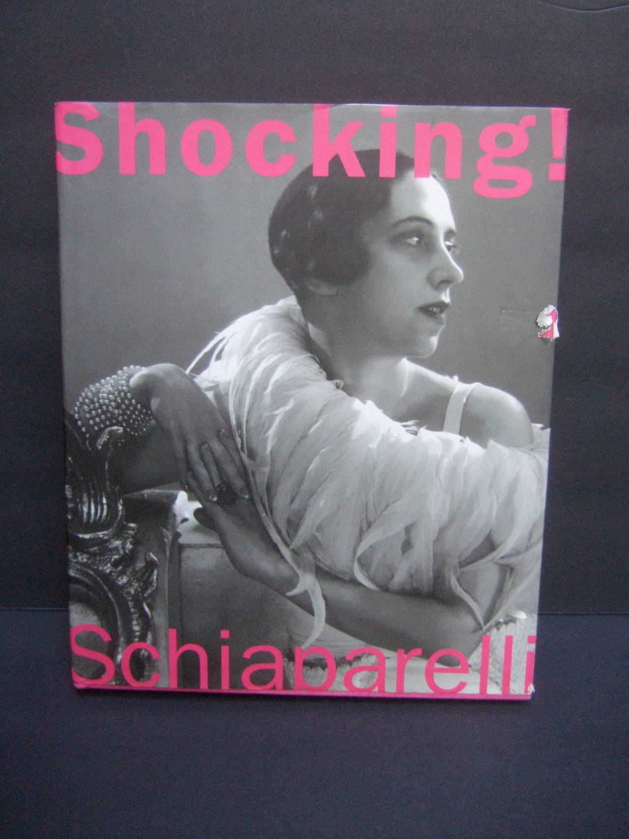 Shocking The art and fashion of Elsa Schiaparelli book 2003
The hardcover book is illustrated with numerous images
of Schiaparelli's avant-garde couture designs

The text chronicles her colorful life and career as one of the early 20th 
century