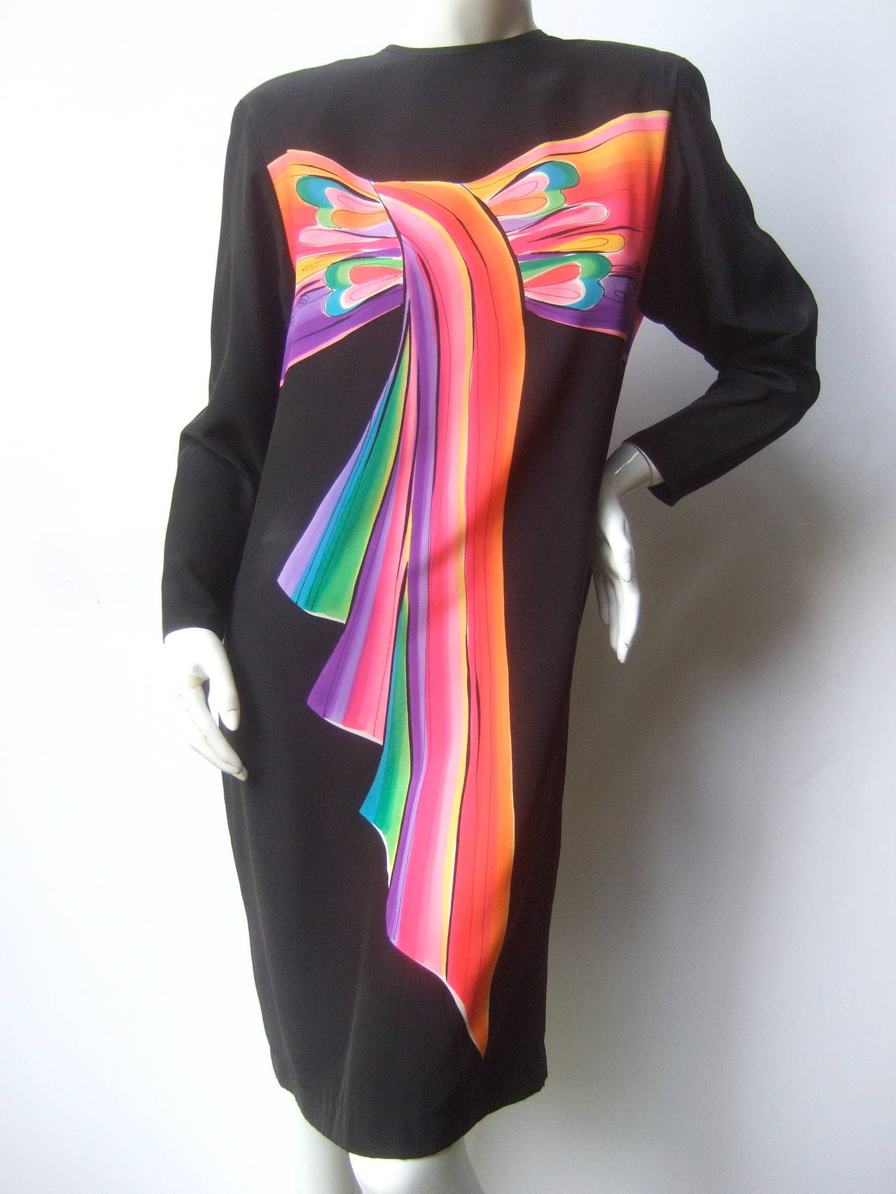 Avant-garde Hand painted black silk color block dress c 1980s
The unique sheath style dress is designed with a vibrant 
hand painted pastel bow detail that runs across the bodice 
extends down the center

The hand painted pastel design also